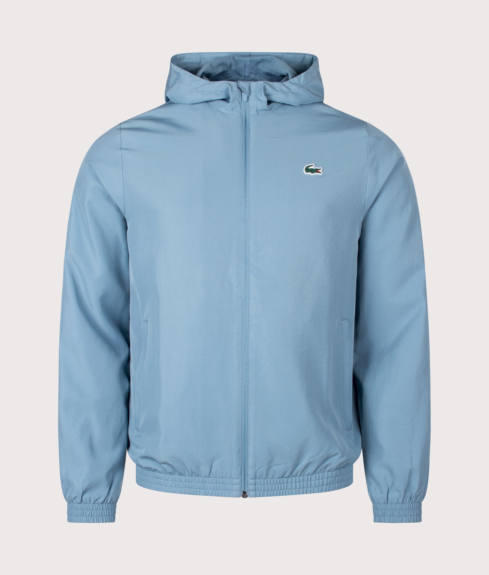 Lacoste Regular Fit Water-Repellent Sport Track Jacket in Aral at EQVVS Menswear. Front shot.