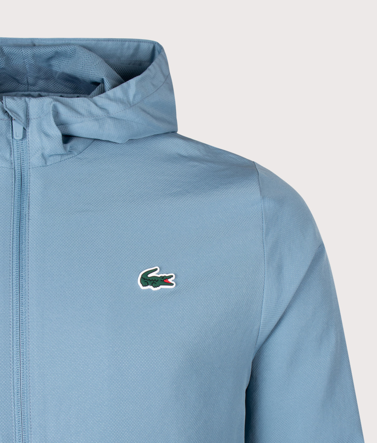 Lacoste Regular Fit Water-Repellent Sport Track Jacket in Aral at EQVVS Menswear. Detail shot.