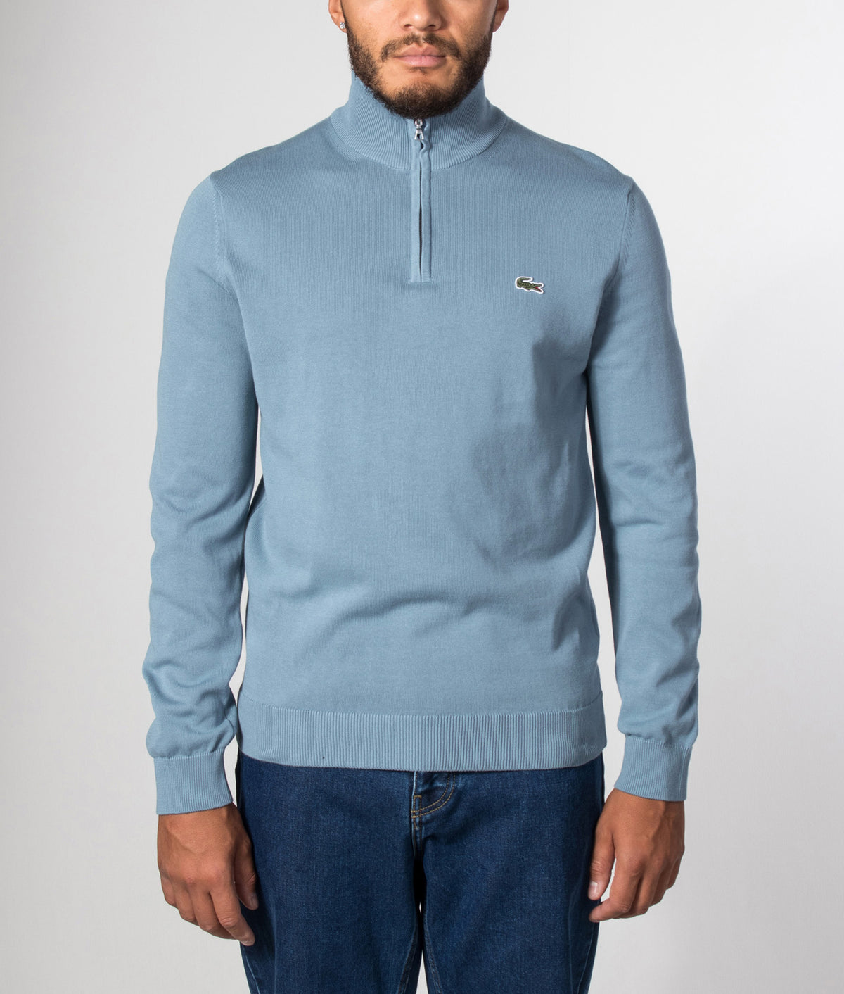 Lacoste Regular Fit Quarter Zip Knit Jumper in Aral at EQVVS Menswear. Model front shot.