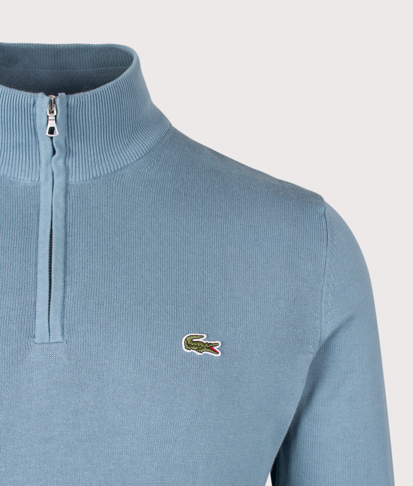 Lacoste Regular Fit Quarter Zip Knit Jumper in Aral at EQVVS Menswear. Detail shot.