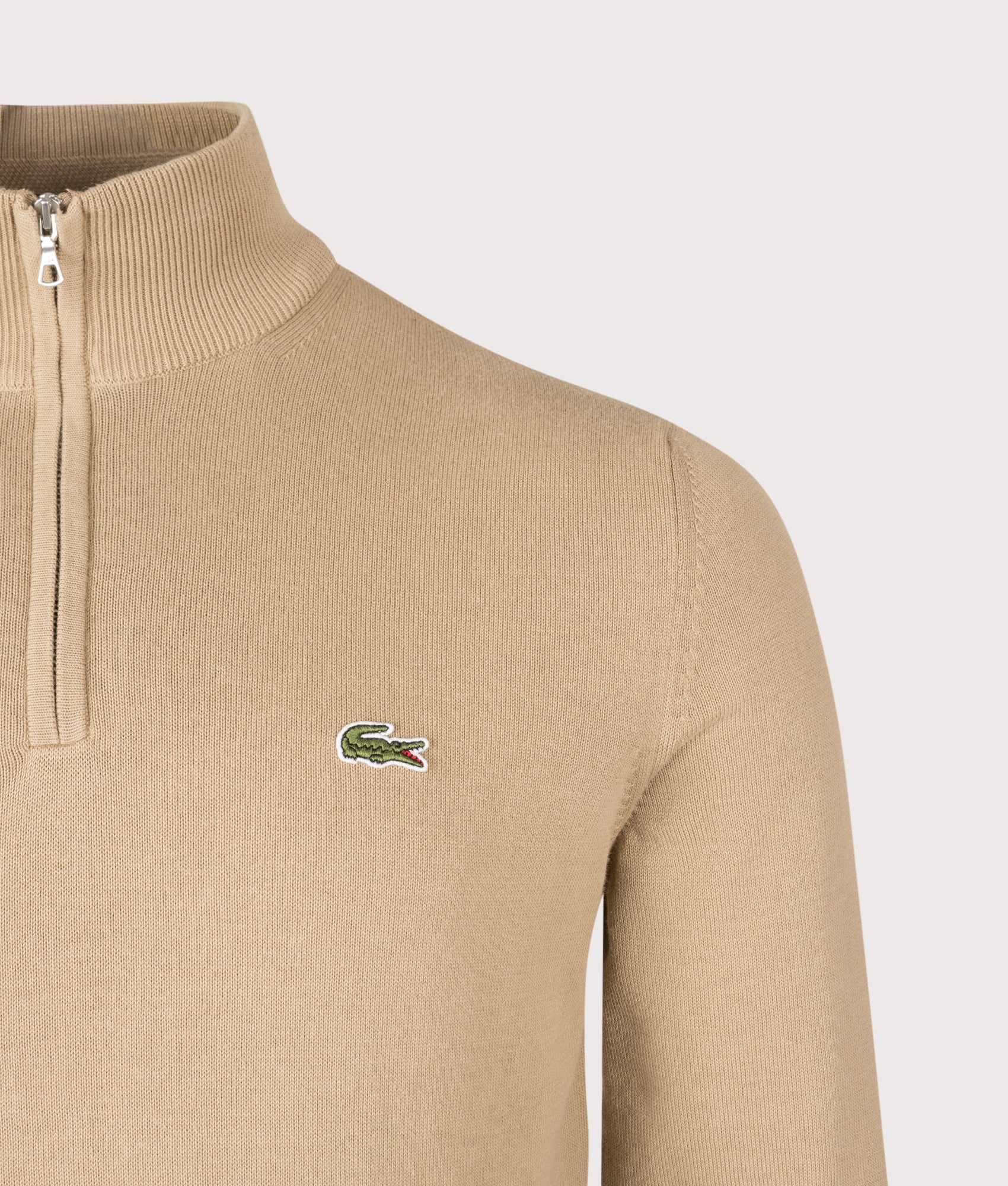 Lacoste Regular Fit Quarter Zip Knit Jumper in Cookie at EQVVS Menswear. Detail shot.