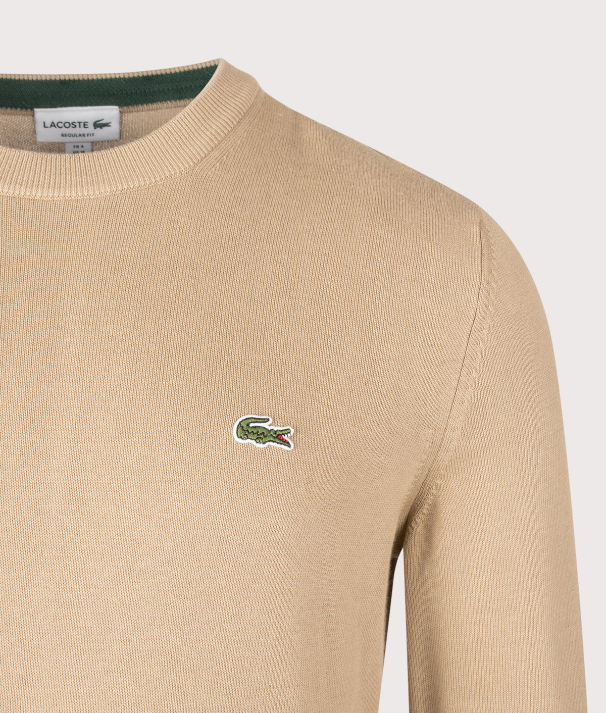 Lacoste Regular Fit Croc Logo Knitted Jumper in Cookie at EQVVS Menswear. Detail shot.