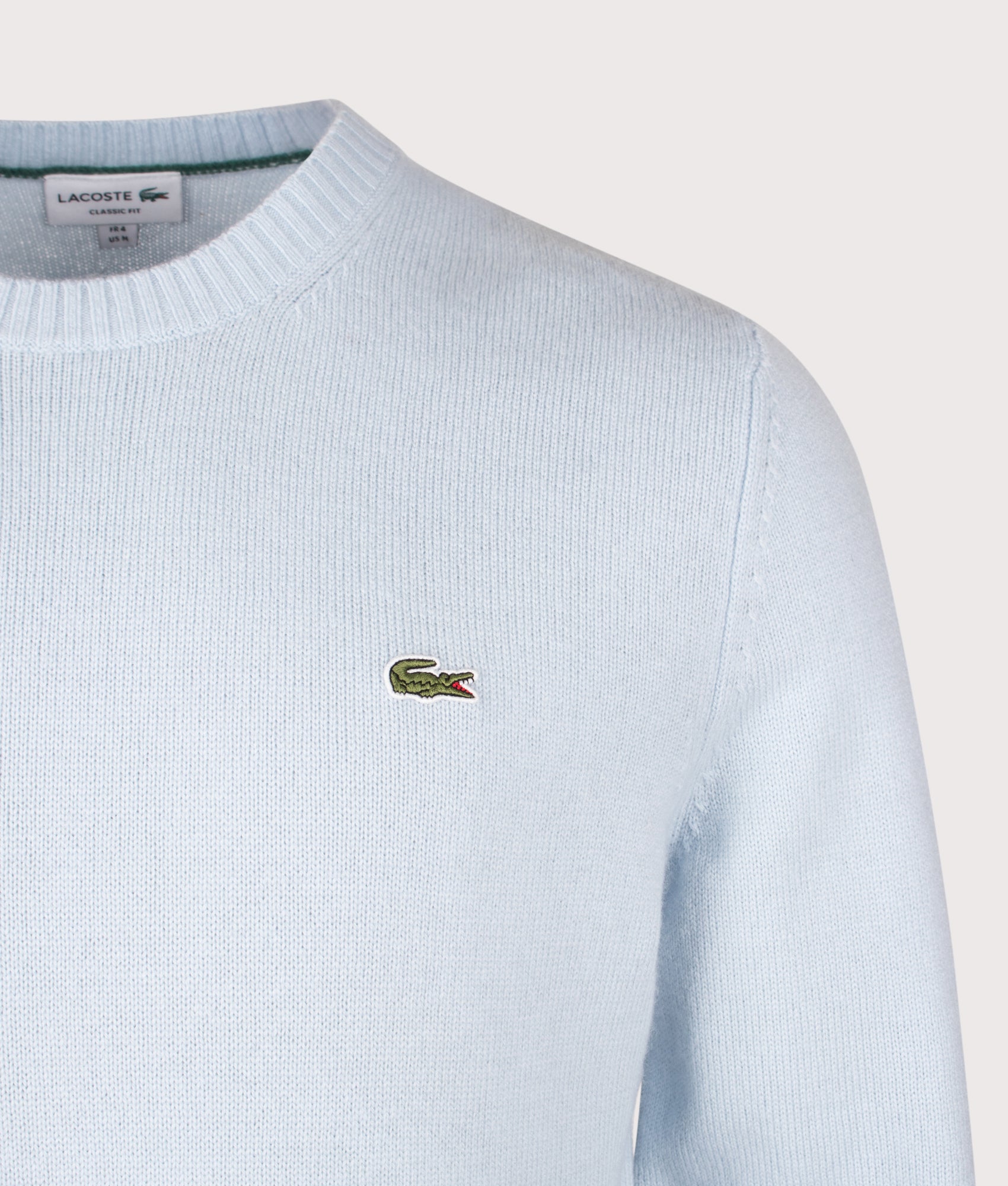 Lacoste Classic Fit Wool Crewneck Jumper in Rill at EQVVS Menswear. Detail shot.