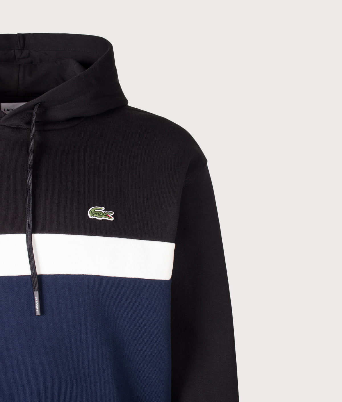 Lacoste Classic Fit Colour Block Hoodie in Black and Navy Blue at EQVVS Menswear. Detail shot.