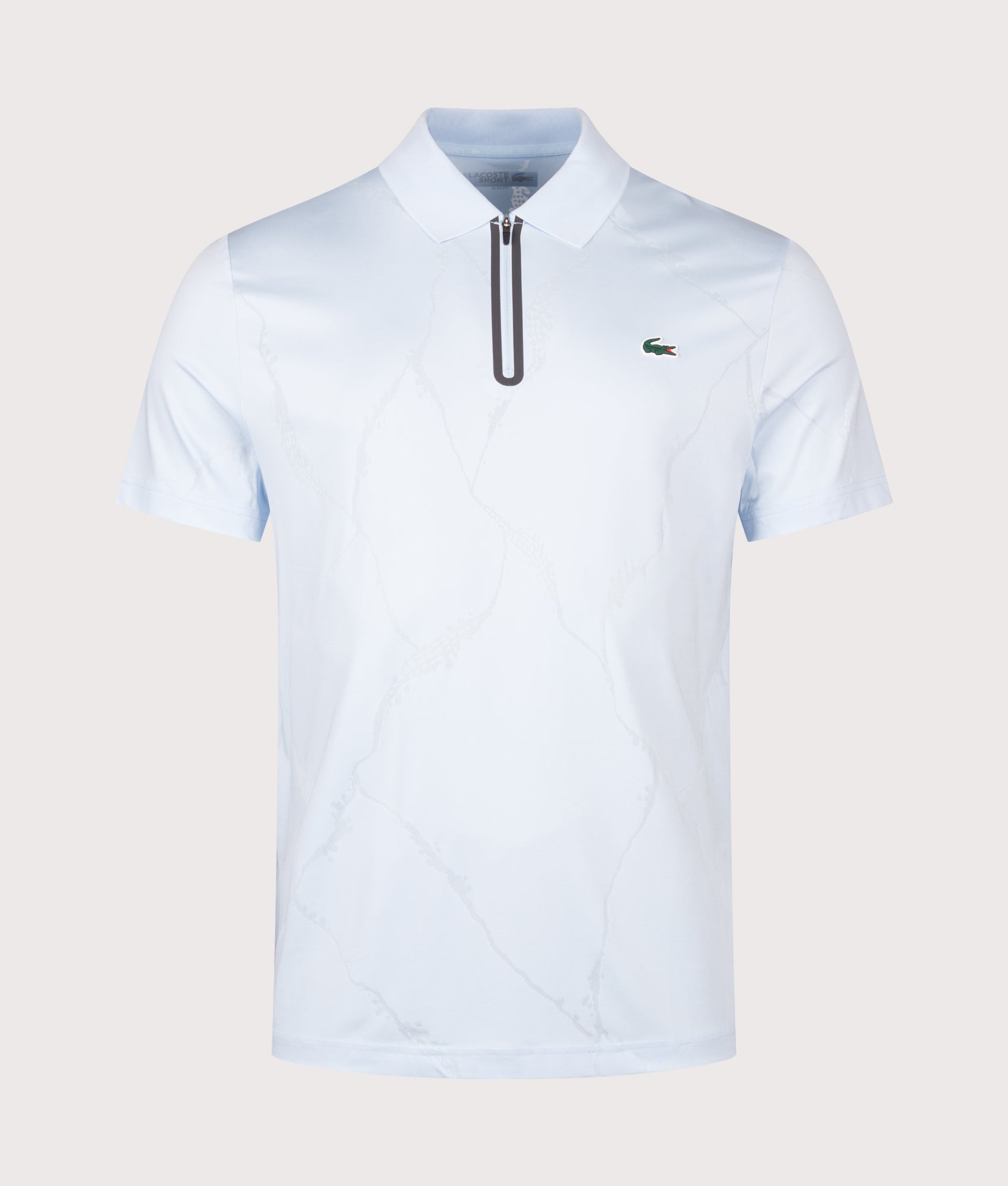 Lacoste Slim Fit Ultra Dry Jacquard Crocodile Tennis Polo Shirt in Sugared Blue at EQVVS Menswear. Front shot.