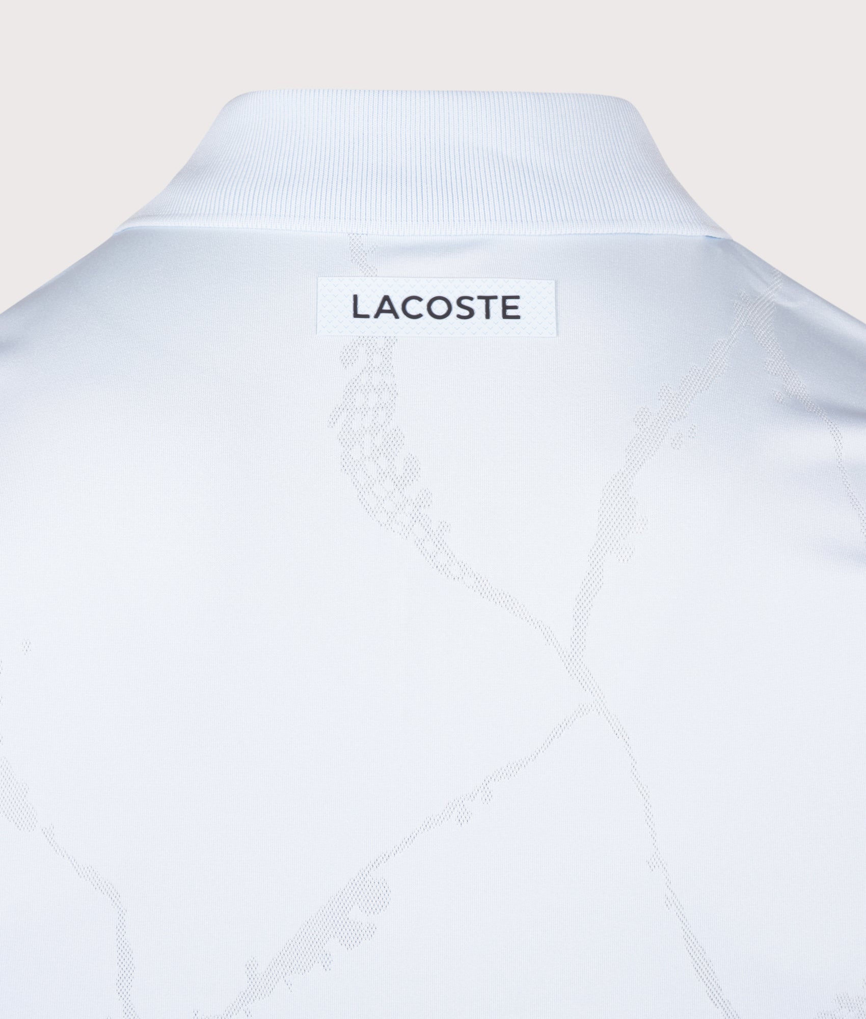 Lacoste Slim Fit Ultra Dry Jacquard Crocodile Tennis Polo Shirt in Sugared Blue at EQVVS Menswear. Back detail shot.