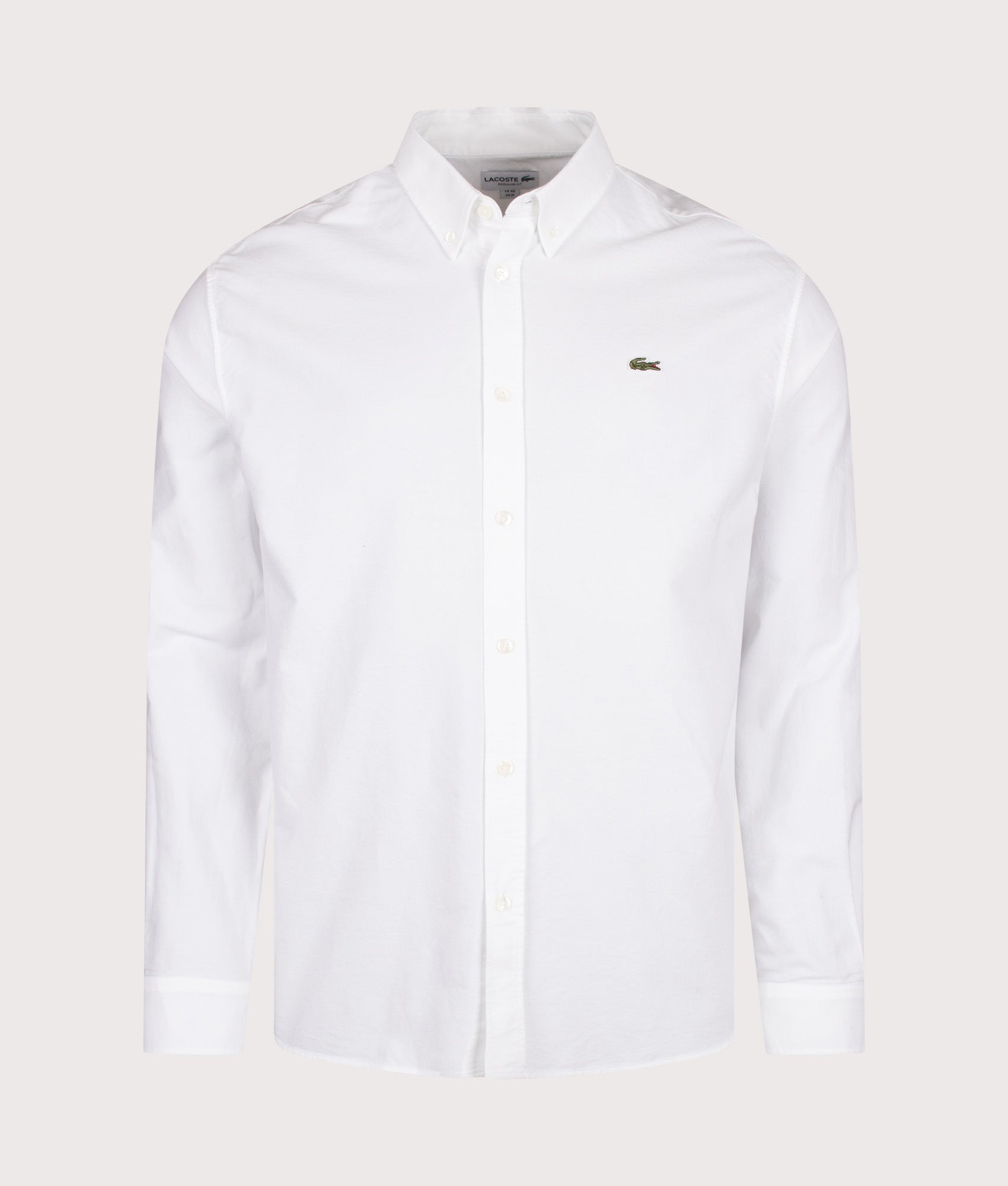 Lacoste Regular Fit Oxford Shirt in White at EQVVS Menswear. Front shot.