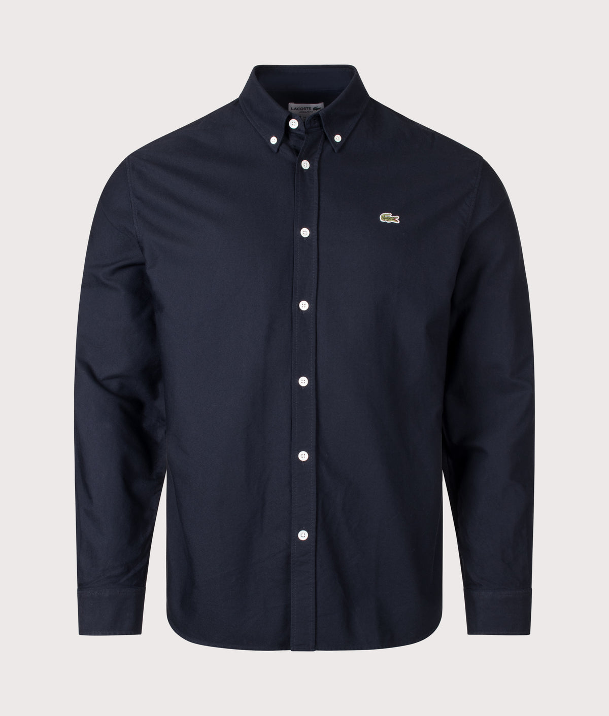 Lacoste Regular Fit Oxford Shirt arrives in Abysm at EQVVS Menswear. Front shot.