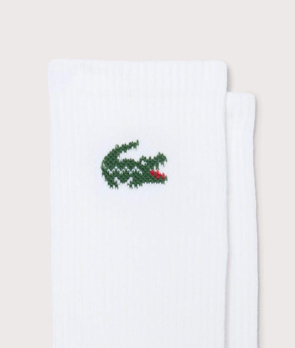 Lacoste 3 Pack Sport Socks in White at EQVVS Menswear. Detail shot.