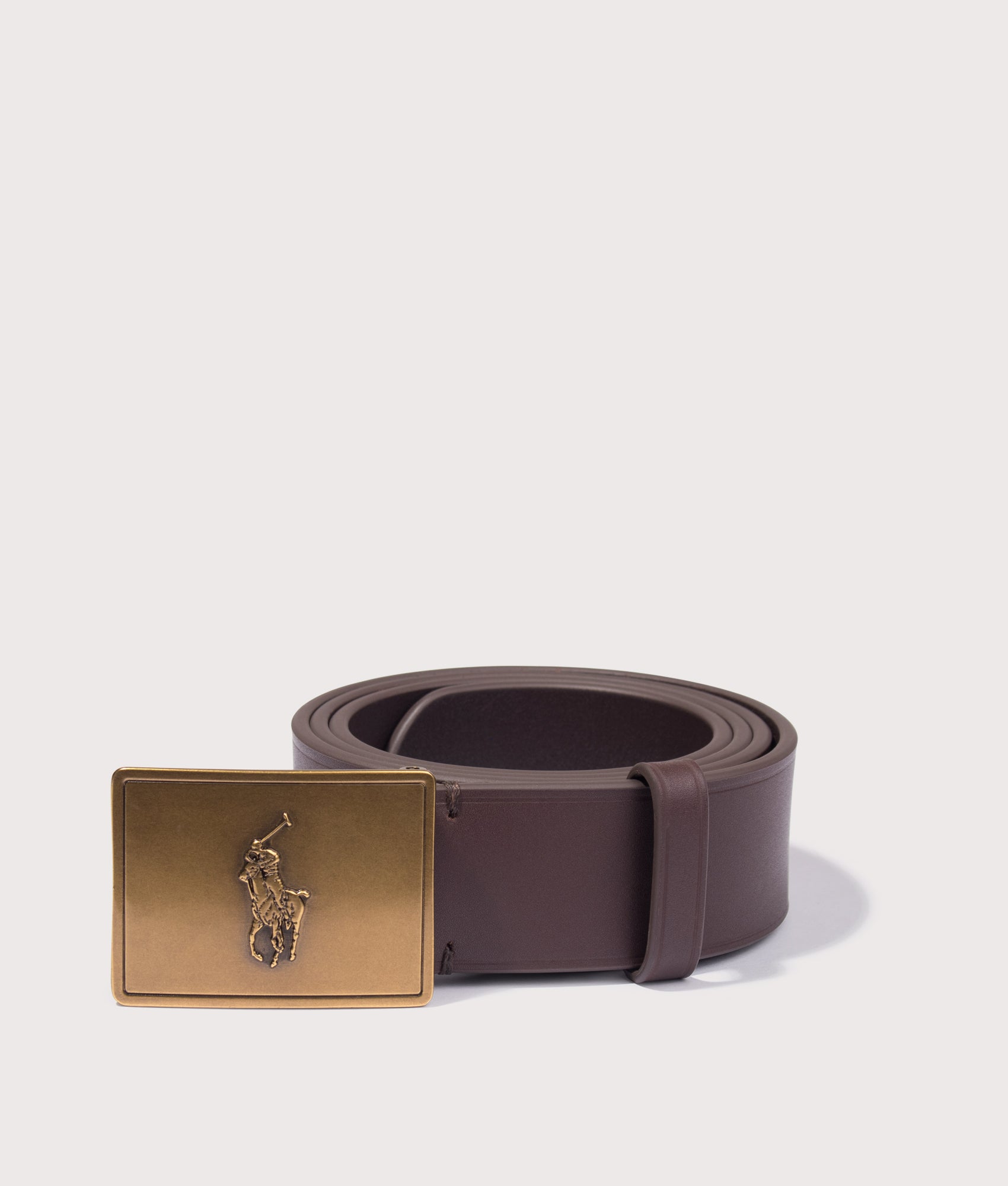 Polo Ralph Lauren Pony Plaque Leather Belt in Brown at EQVVS Menswear. Rolled shot.