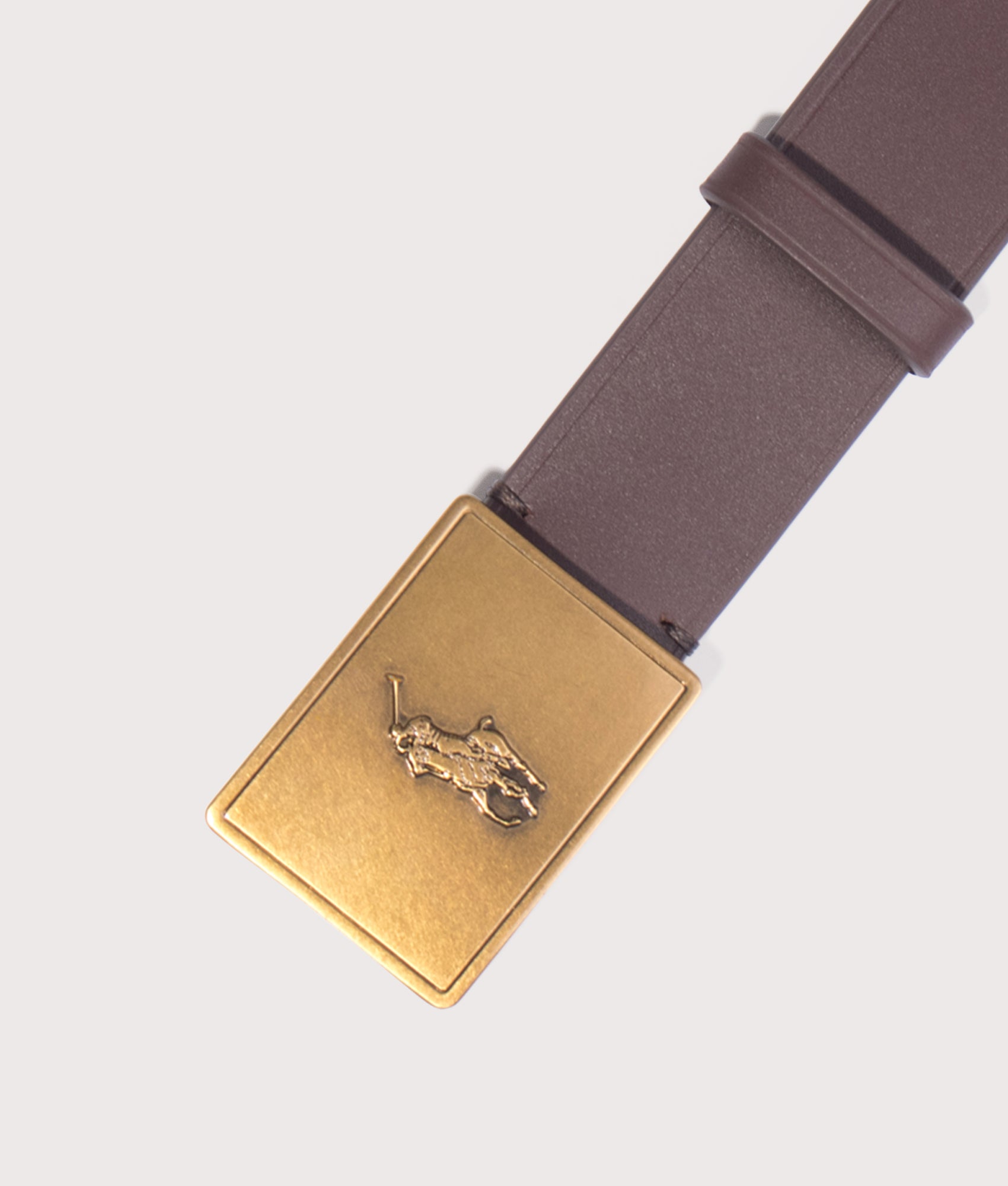Polo Ralph Lauren Pony Plaque Leather Belt in Brown at EQVVS Menswear. Buckle shot.