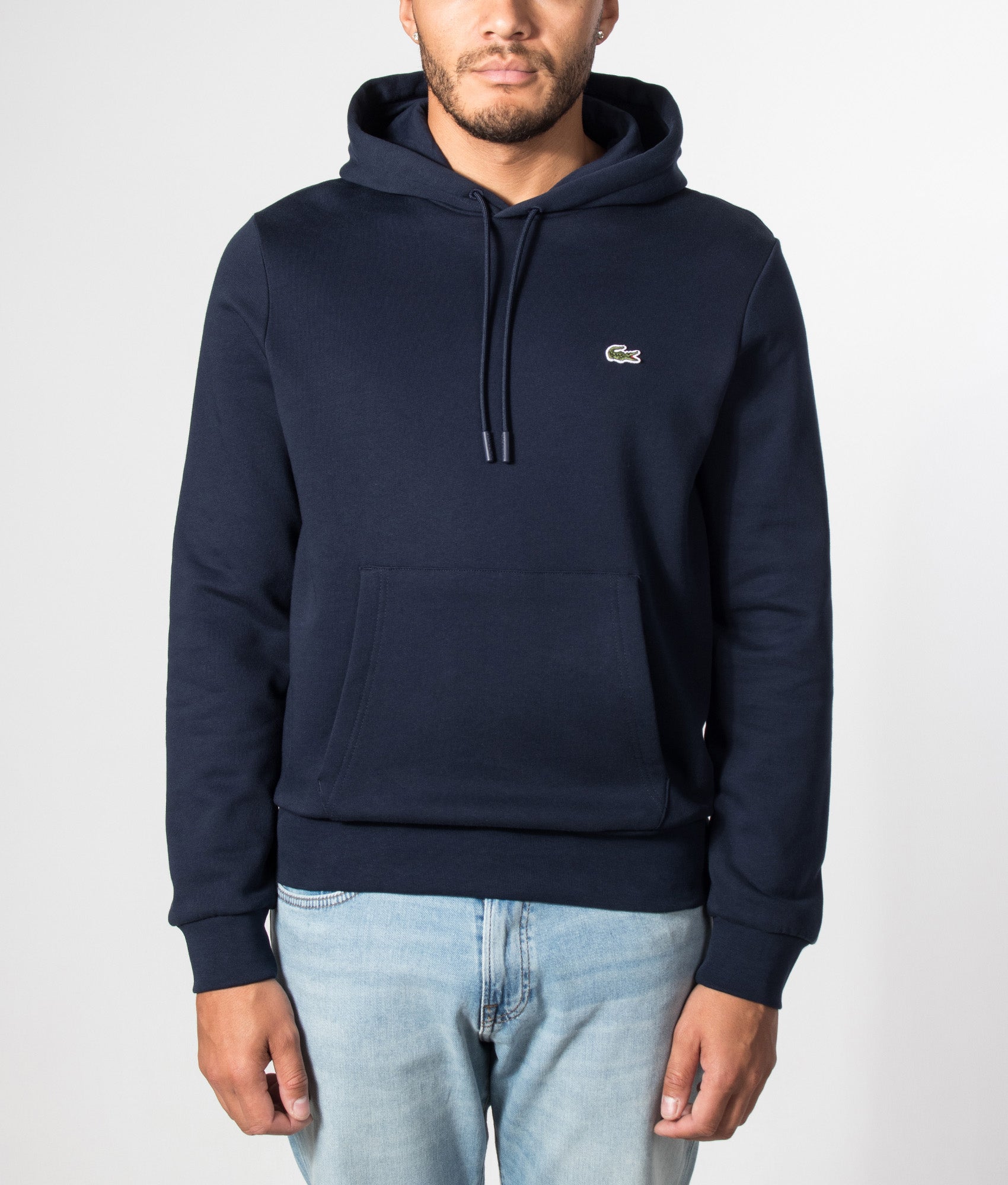 Lacoste Brushed Fleece Hoodie Navy in Navy Blue at EQVVS Menswear. Model front shot.