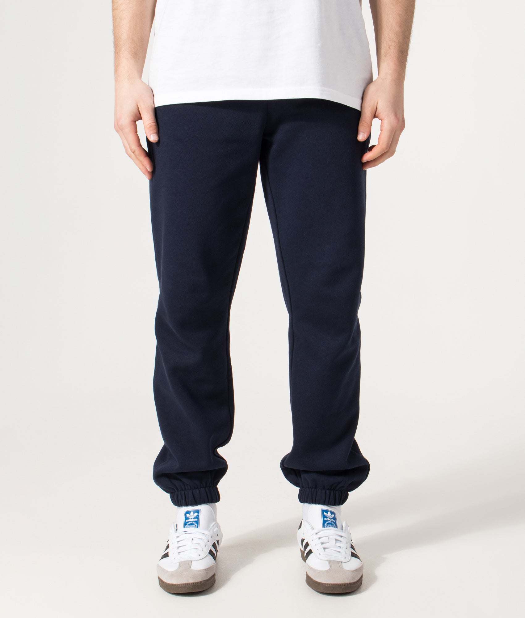 Lacoste Regular Fit Brushed Fleece Joggers in Navy Blue at EQVVS Menswear. Model front shot.