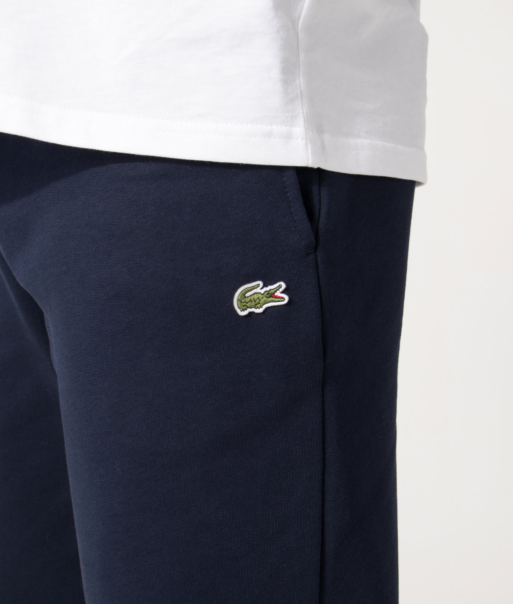 Lacoste Regular Fit Brushed Fleece Joggers in Navy Blue at EQVVS Menswear. Detail shot.