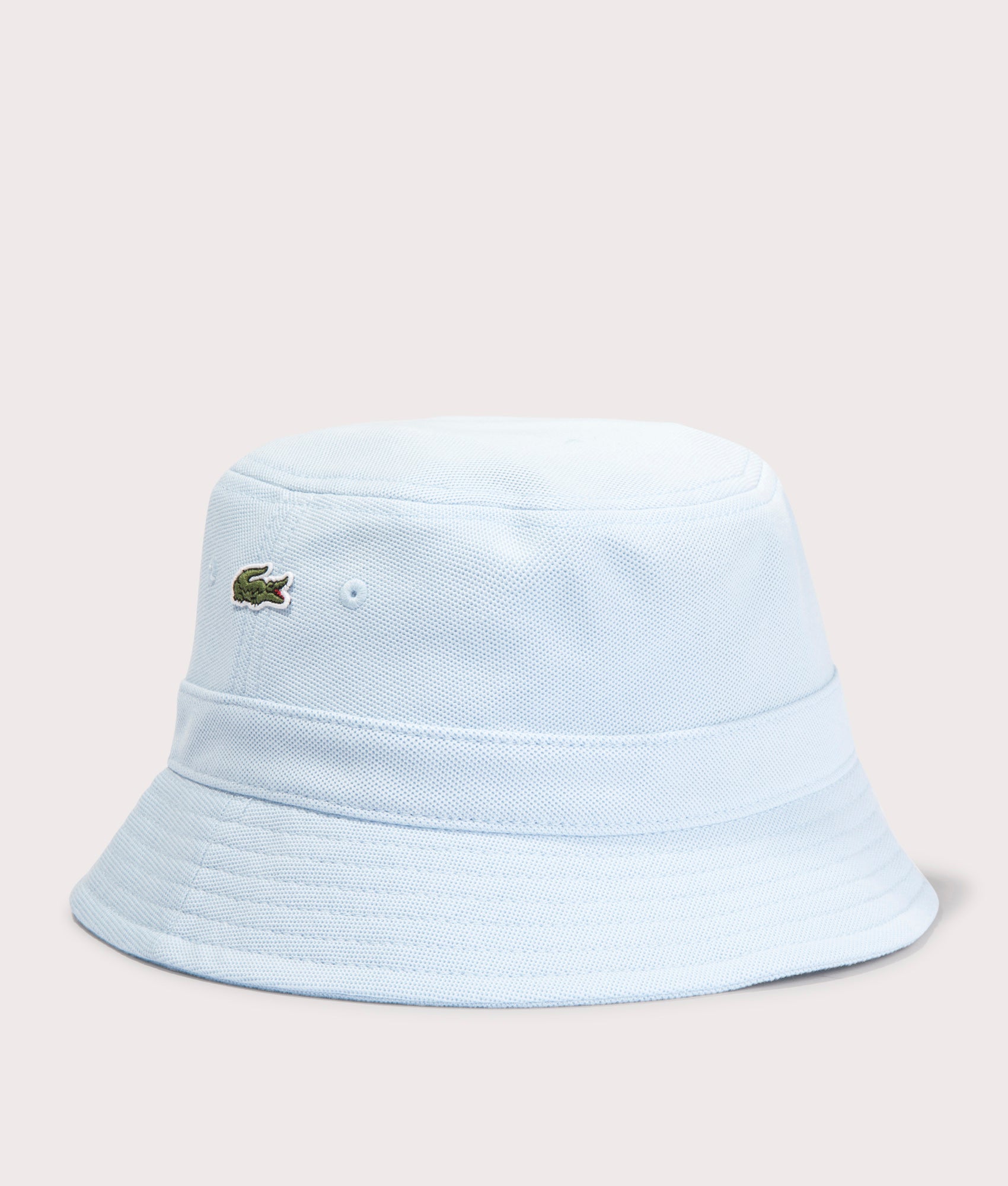 Lacoste Piqué Bucket Hat in Rill  blue t EQVVS. Angle shot.