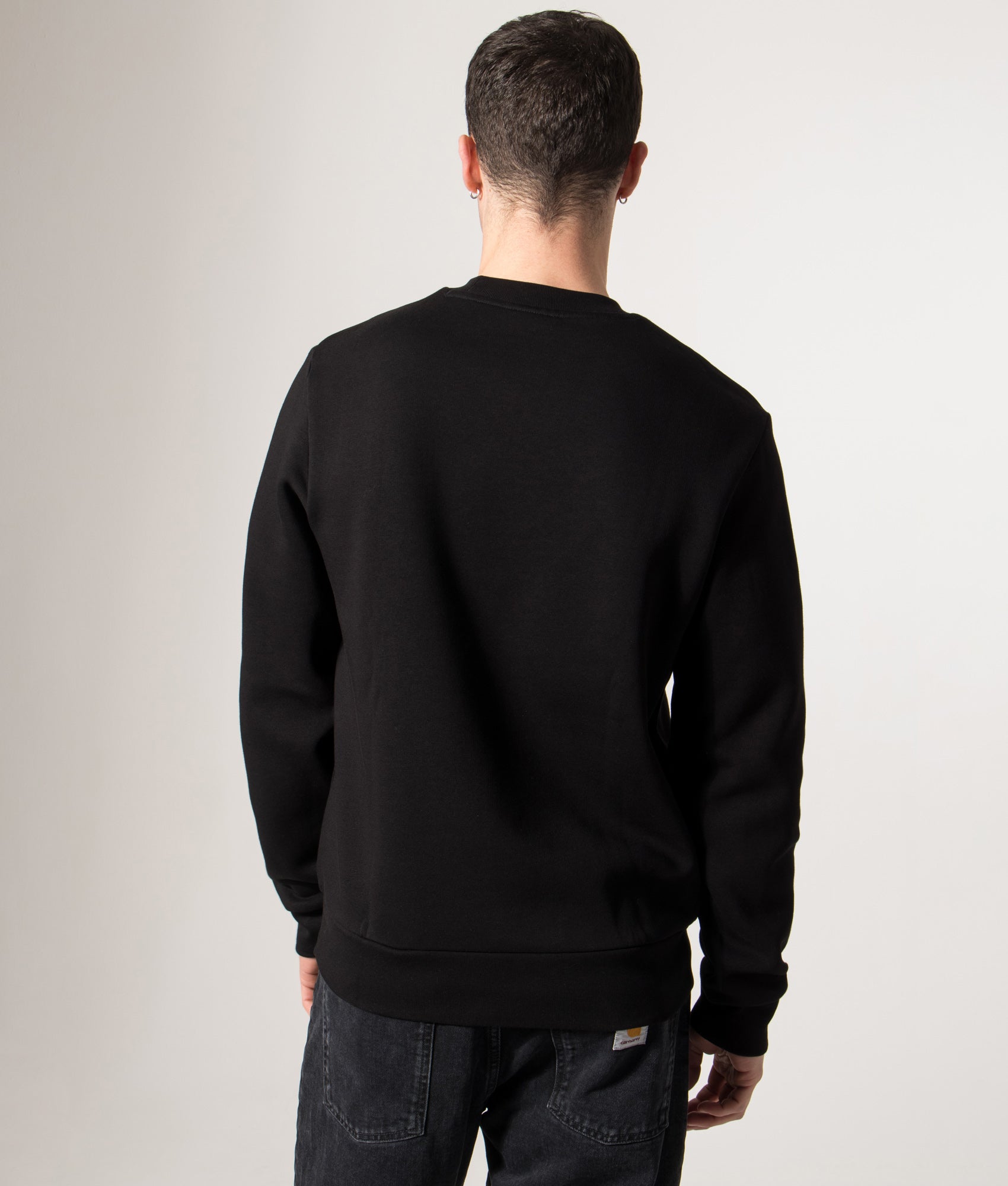 Lacoste Relaxed Fit Brushed Cotton Sweatshirt in Black at EQVVS Menswear. Model back shot. 