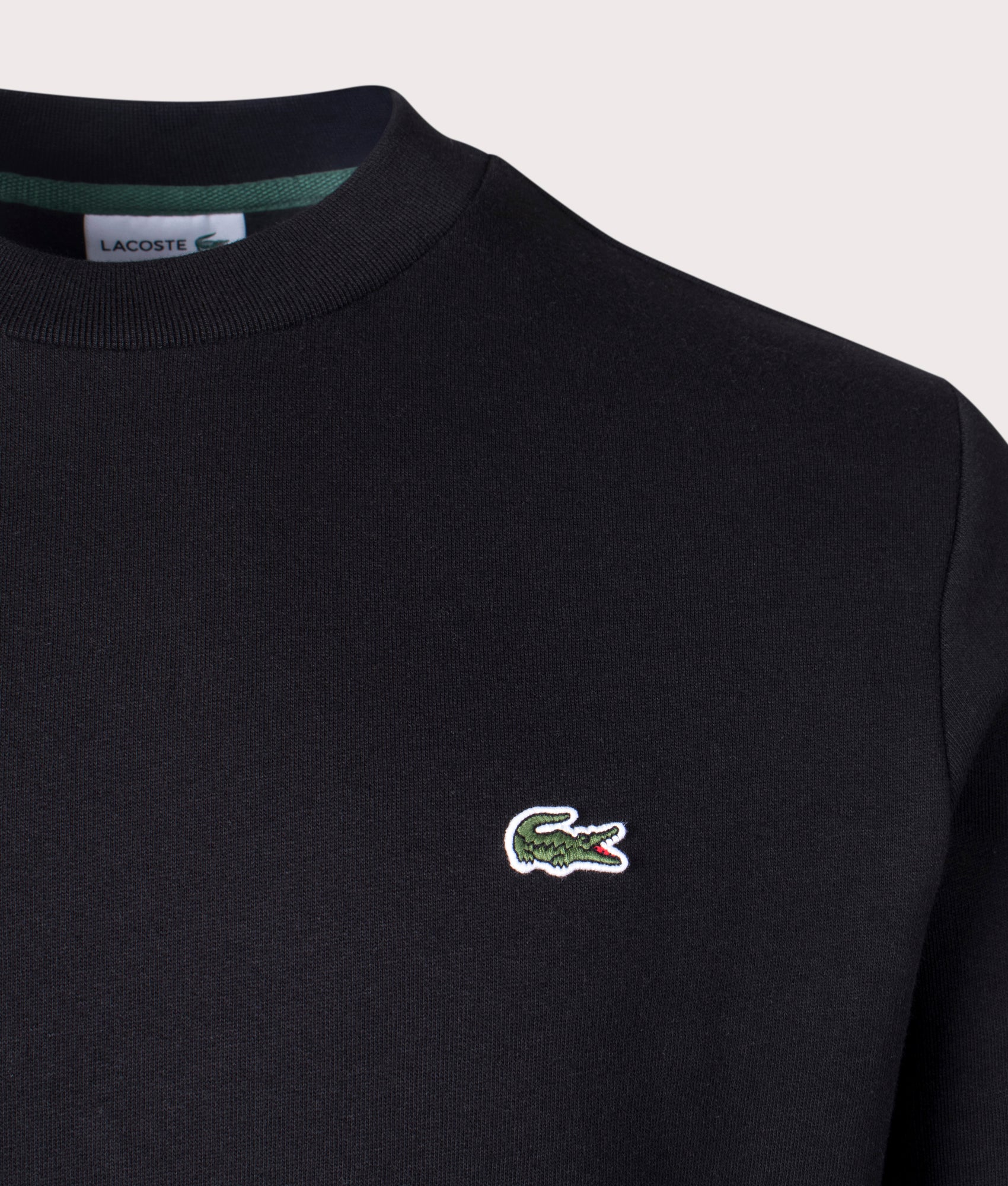 Lacoste Relaxed Fit Brushed Cotton Sweatshirt in Black at EQVVS Menswear. Detail shot.