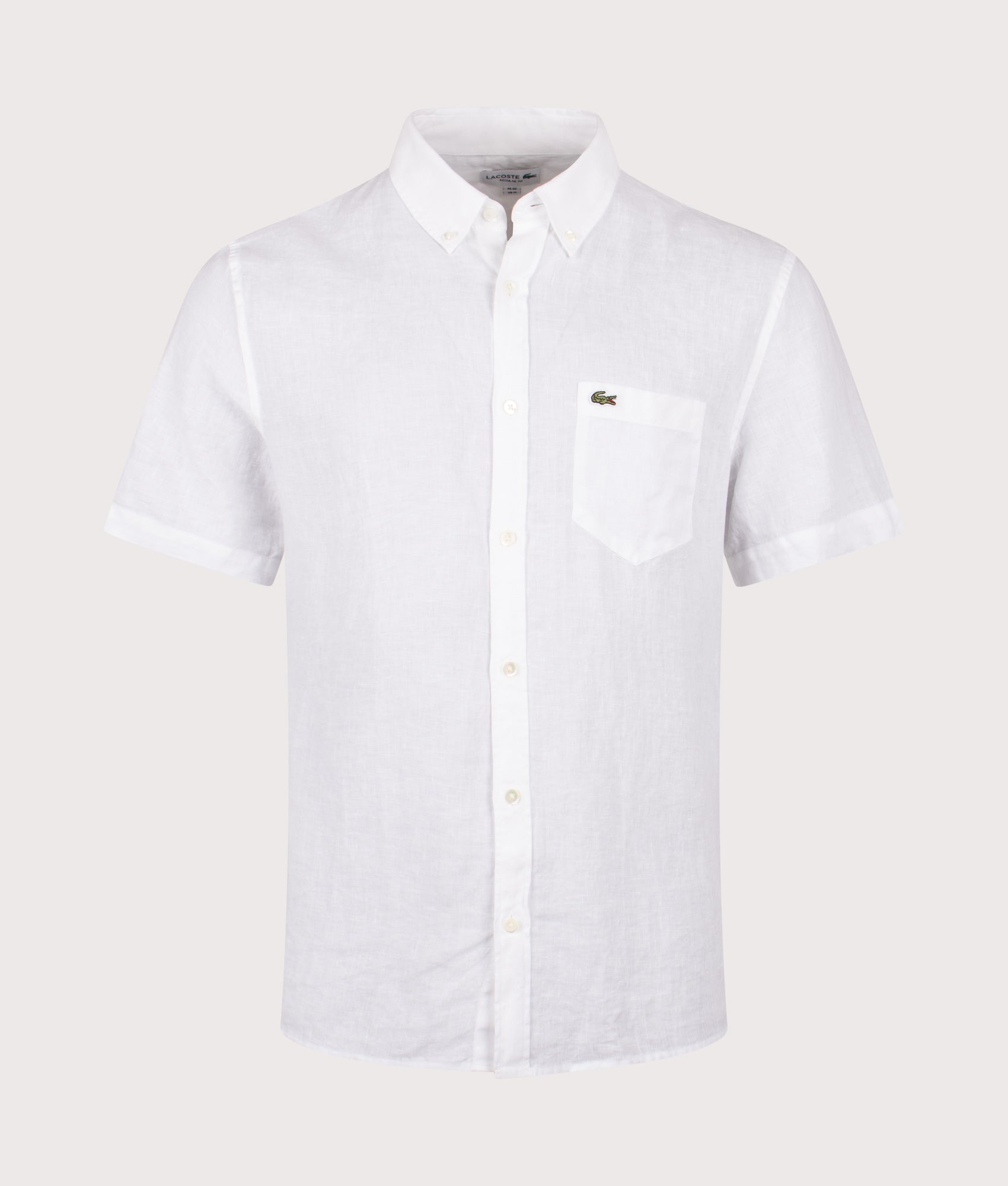 Lacoste Short Sleeve Linen Shirt in White at EQVVS Menswear. Front shot.