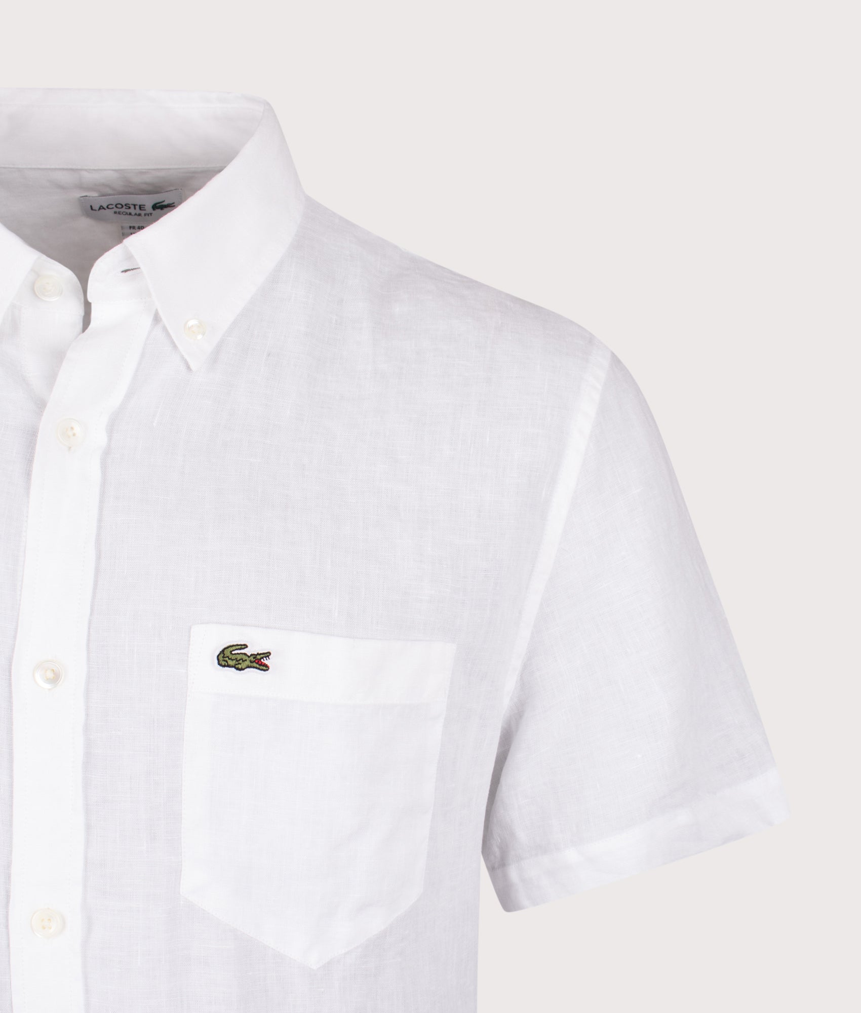 Lacoste Short Sleeve Linen Shirt in White at EQVVS Menswear. Detail shot.