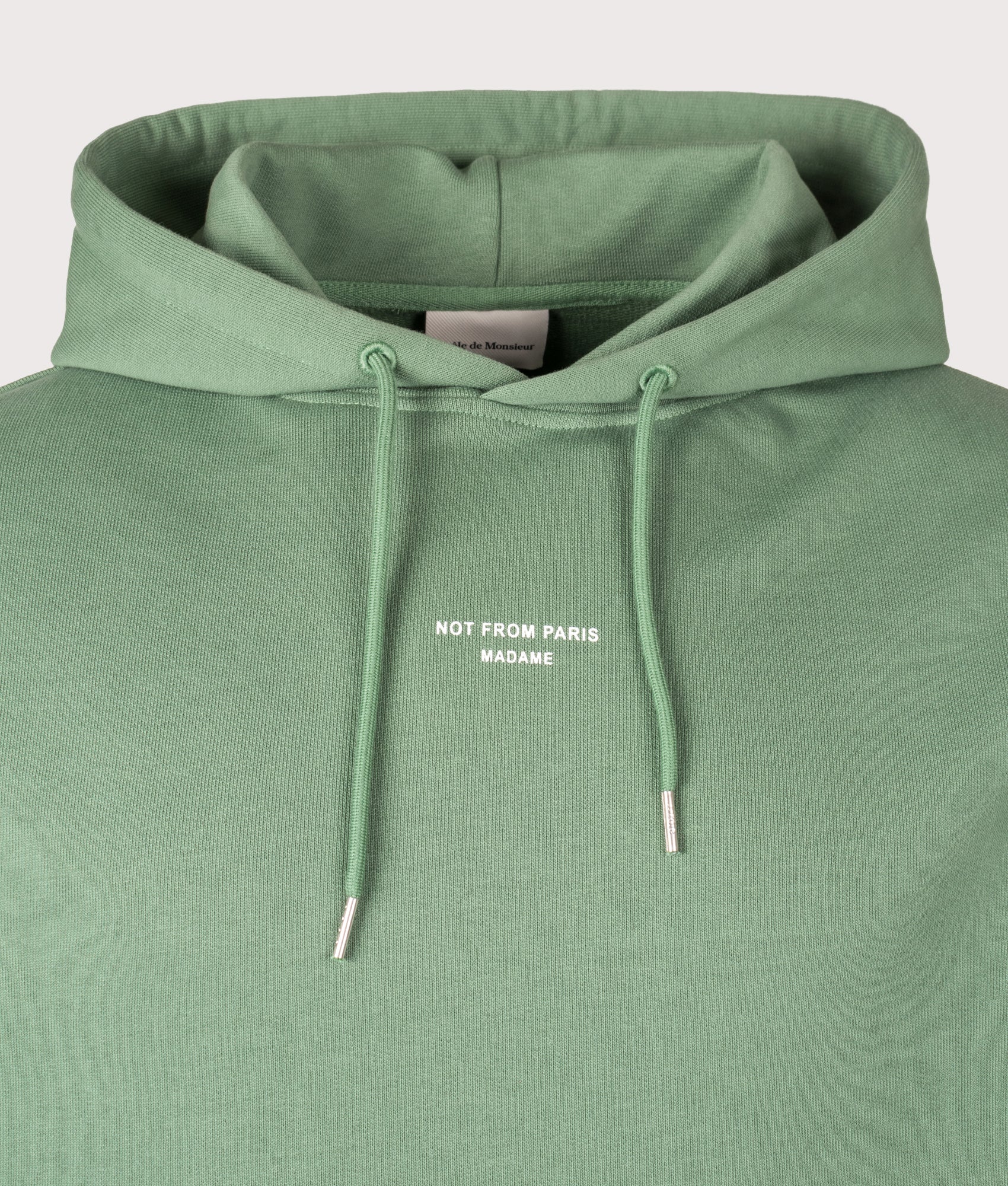 Relaxed Fit Le Hoodie Slogan Classique in Water Green | 100% Cotton | Drôle de Monsieur | EQVVS | Front detail shot 