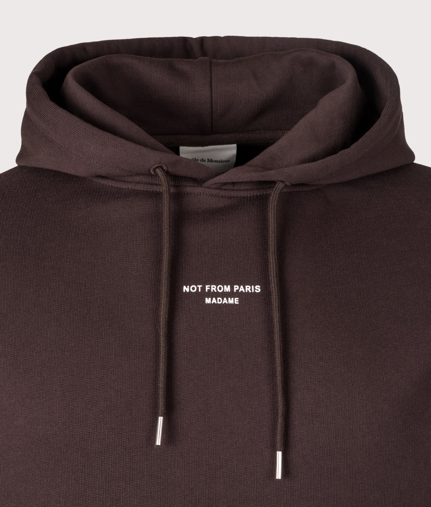 Relaxed Fit Le Hoodie Slogan Classique in Dark Brown | 100% Cotton | Drôle de Monsieur | EQVVS | Front detail shot 