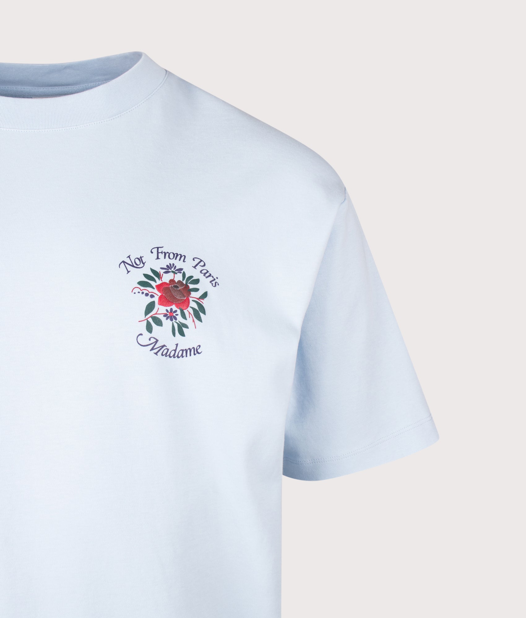 Slogan Rose T-Shirt in Light Blue by Drôle de Monsieur. Shot by EQVVS. Detail Shot.