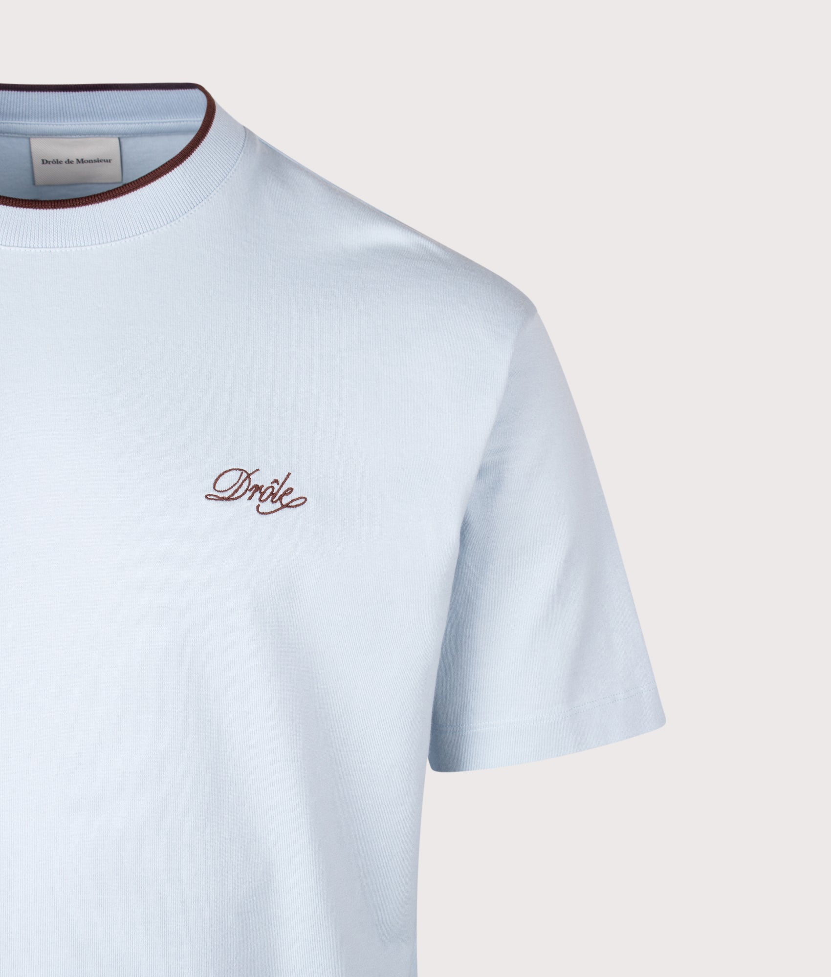 Drôle de Monsieur Drôle Belissima T-Shirt in Light Blue at EQVVS Menswear. Detail shot.