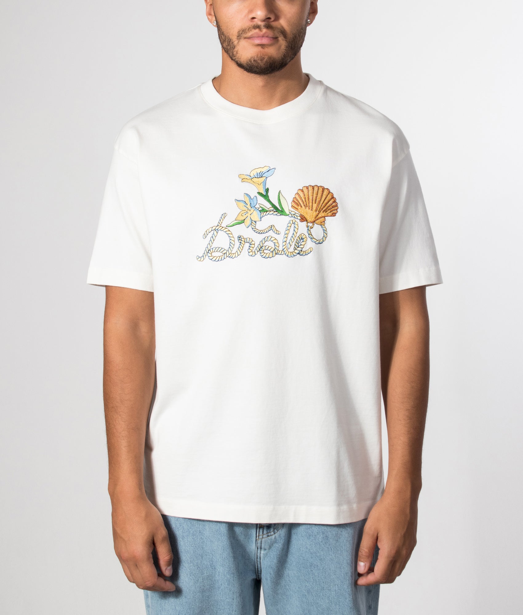 Drôle de Monsieur Drôle Shell T-Shirt in Off White at EQVVS Menswear. Model front shot.