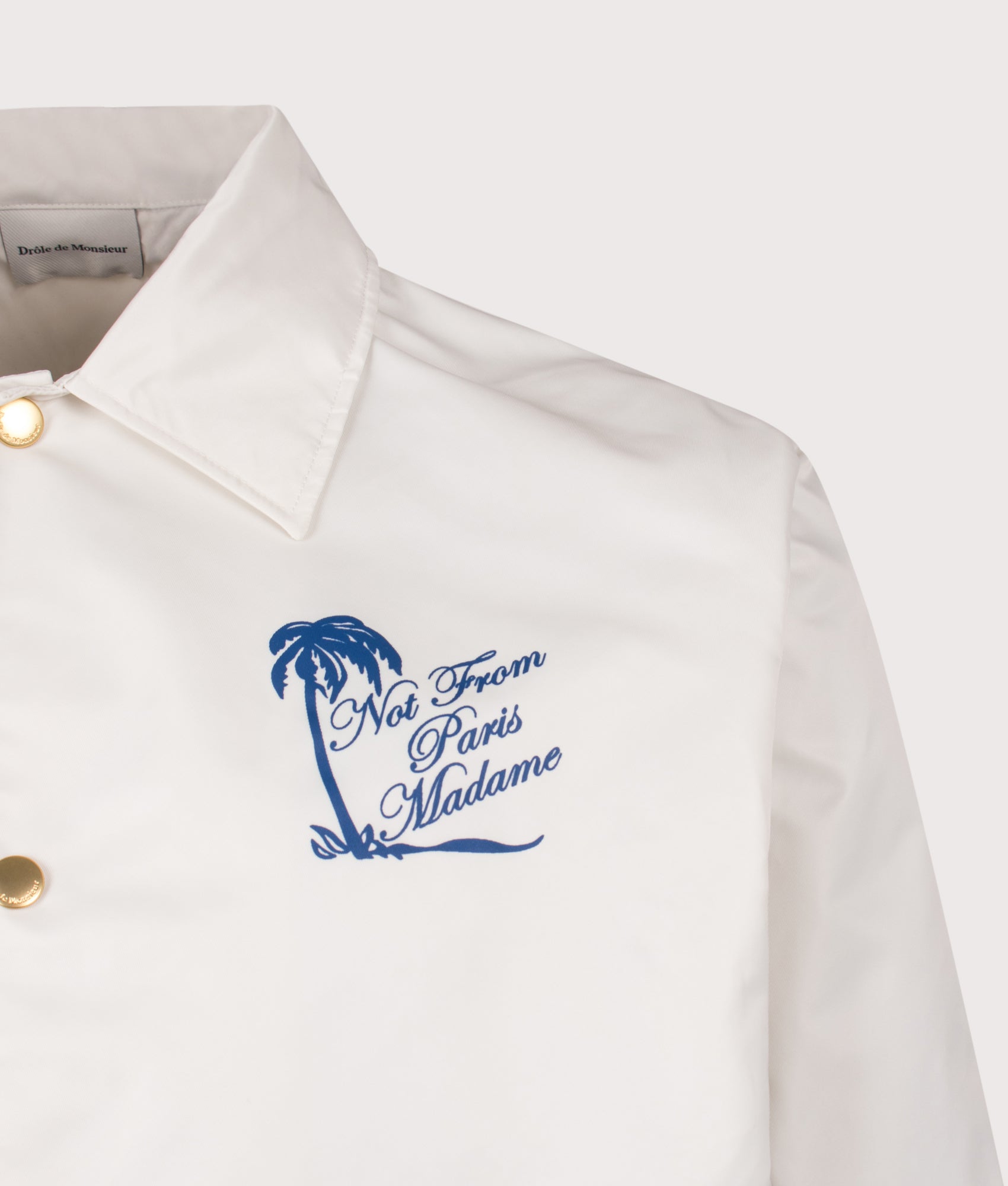 Drôle de Monsieur Relaxed Fit Palm Slogan Jacket in Off White at EQVVS Menswear. Detail shot.