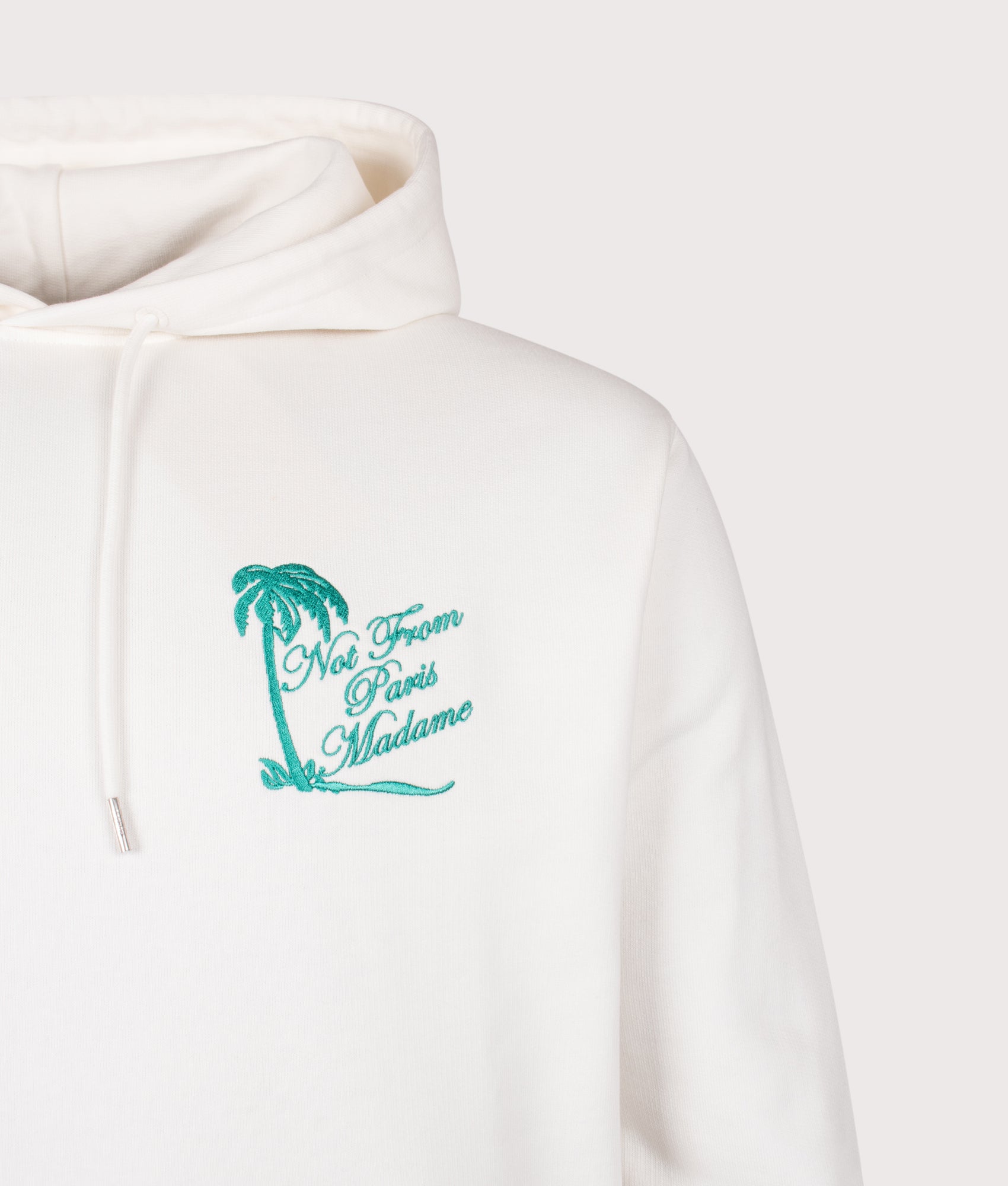 Drôle de Monsieur Relaxed Fit Palm Slogan Hoodie in Off White at EQVVS Menswear. Detail shot.