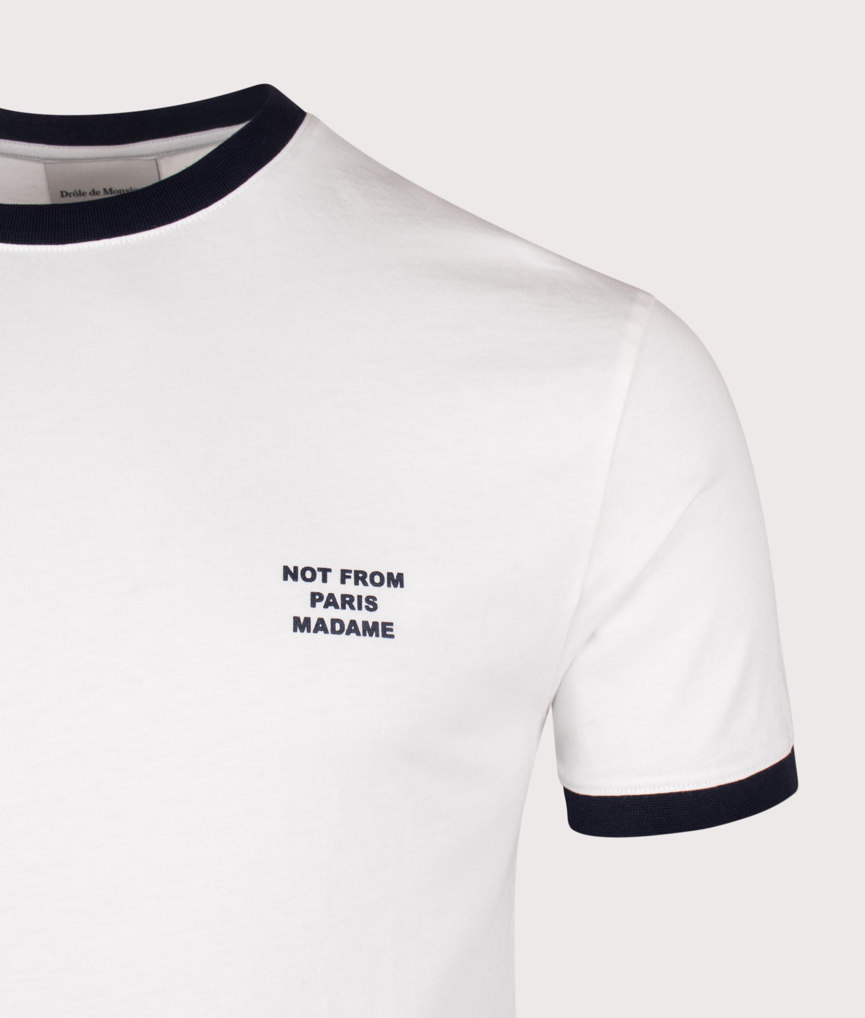 Drôle de Monsieur Contrasted Slogan T-shirt in Off White at EQVVS Menswear. Detail shot.