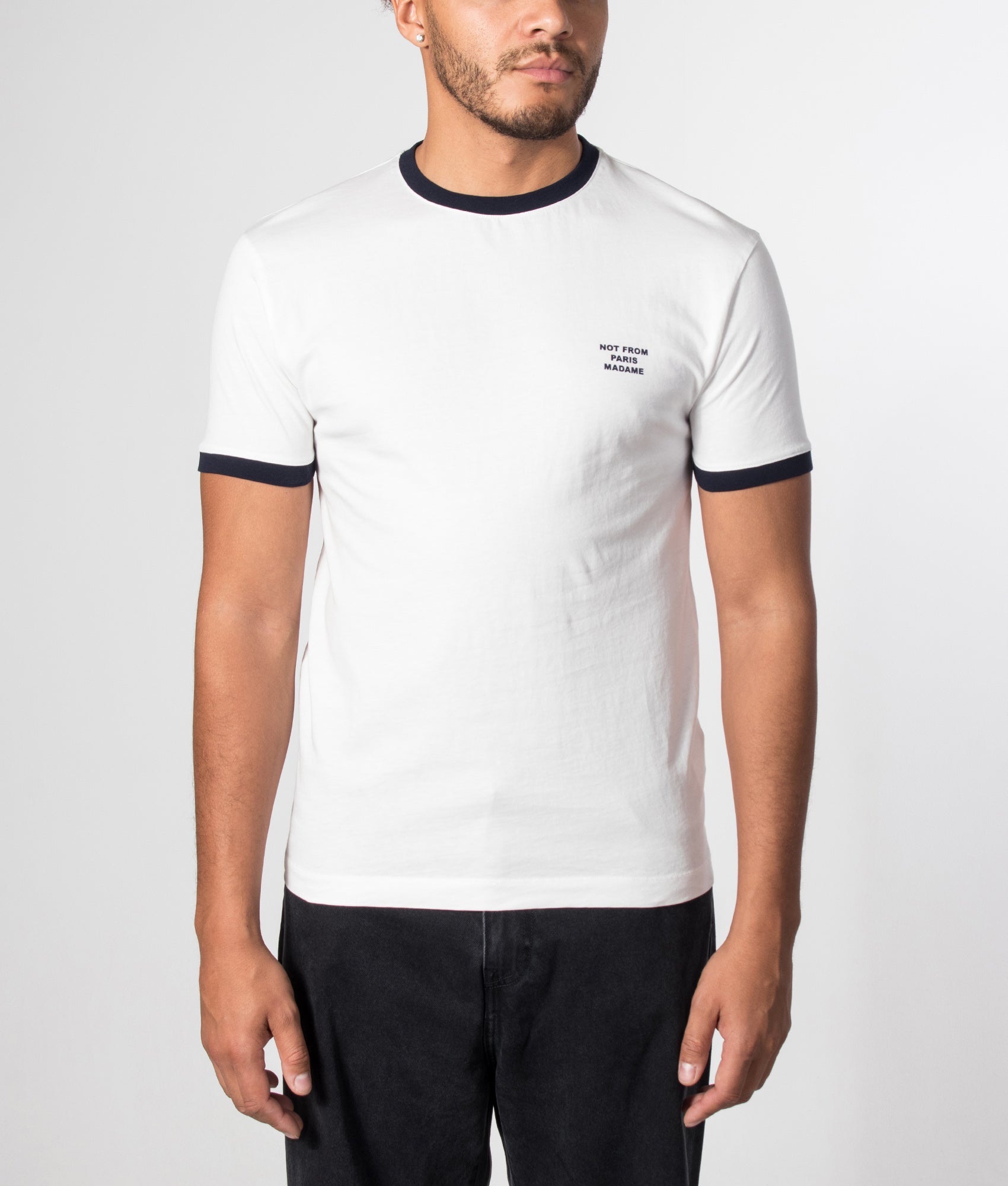 Drôle de Monsieur Contrasted Slogan T-shirt in Off White at EQVVS Menswear. Model front shot.