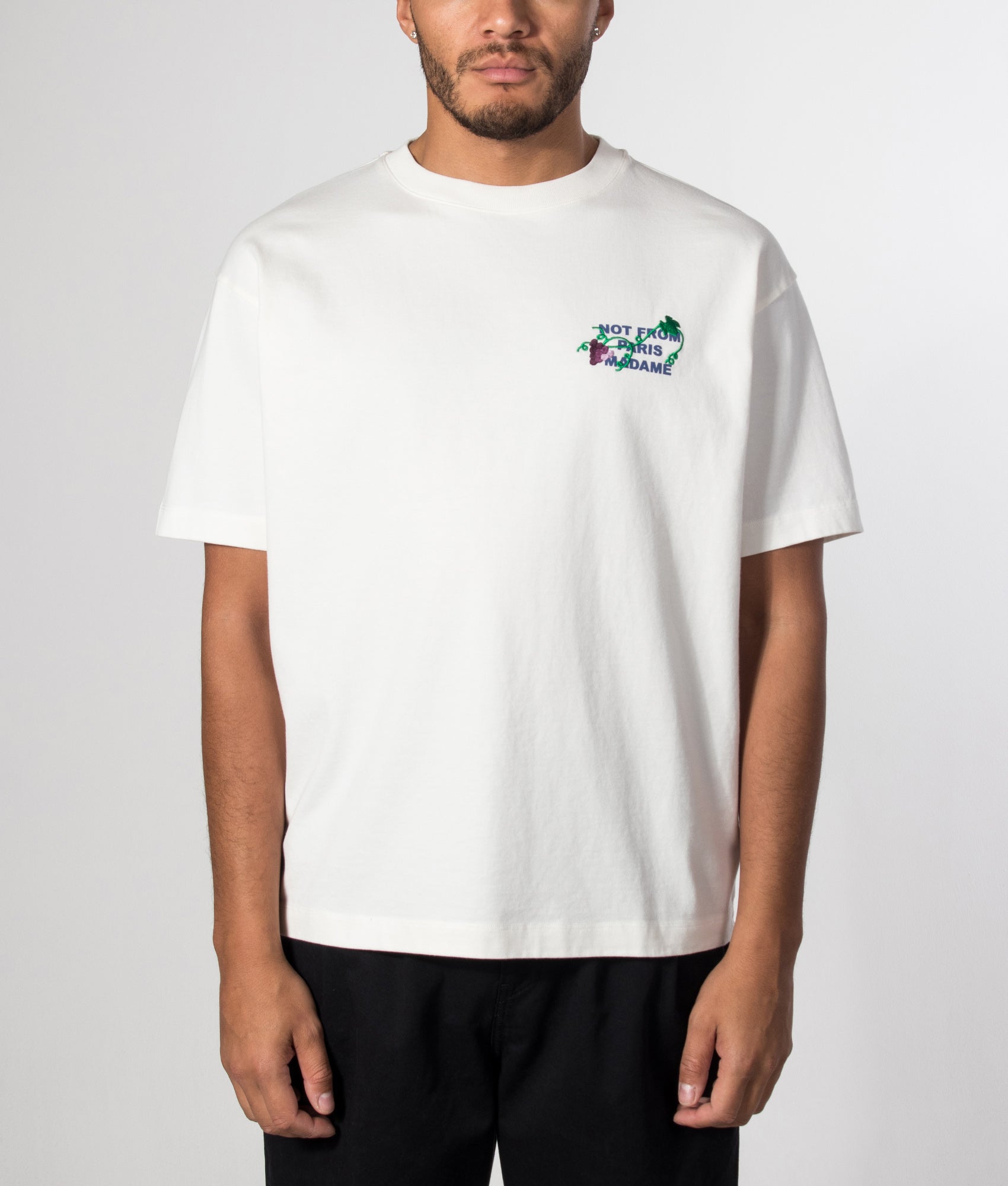 Drôle de Monsieur Relaxed Fit Vine Embroidered Slogan T-shirt in Off White at EQVVS Menswear. Model front shot.