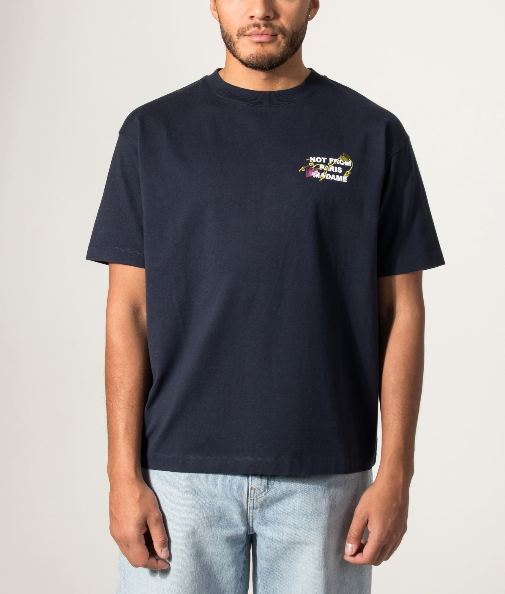 Drôle de Monsieur Relaxed Fit Vine Embroidered Slogan T-shirt in Navy at EQVVS Menswear. Model front shot.