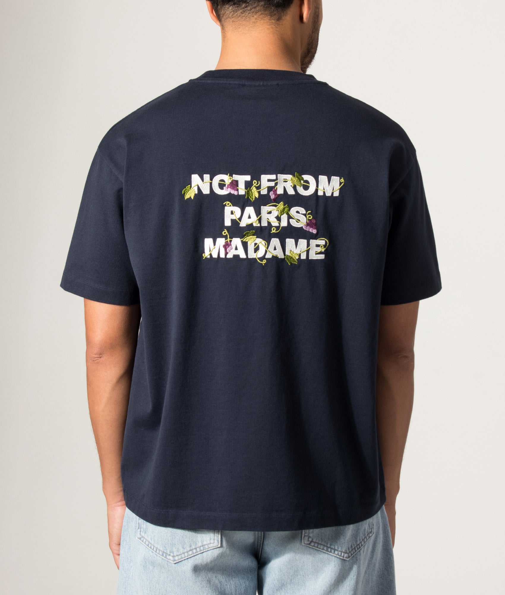 Drôle de Monsieur Relaxed Fit Vine Embroidered Slogan T-shirt in Navy at EQVVS Menswear. Model back shot.