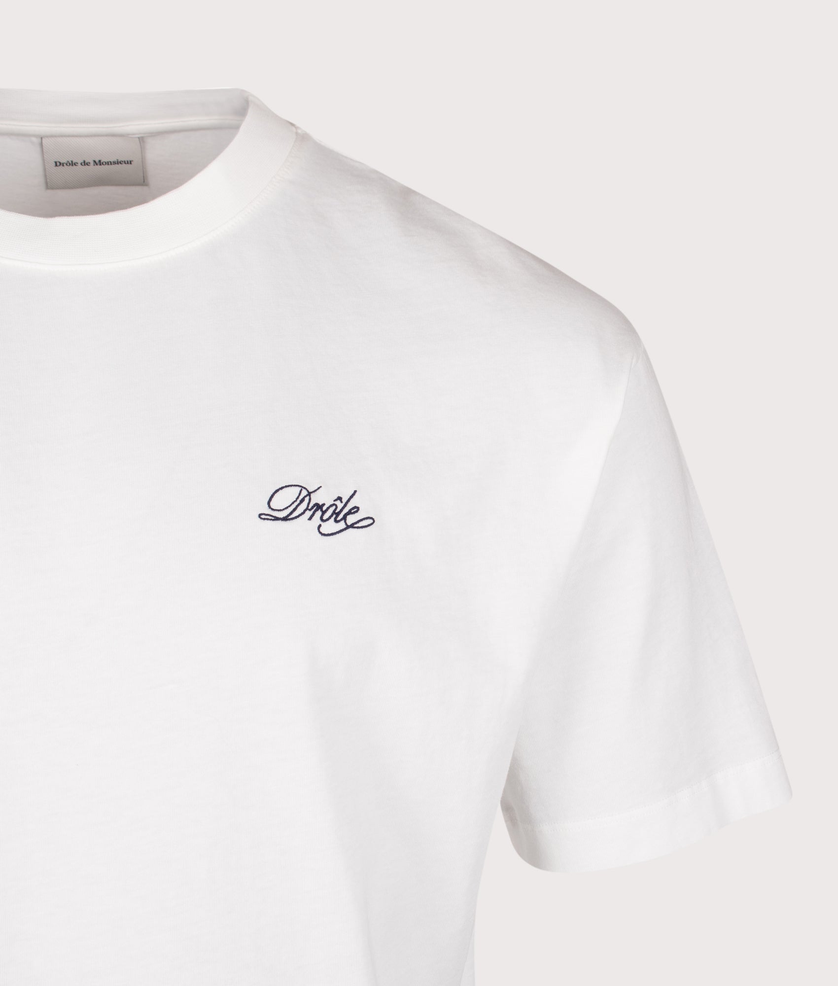 Drôle de Monsieur Relaxed Fit Drôle Belissima T-shirt in Off White at EQVVS Menswear. Detail shot.