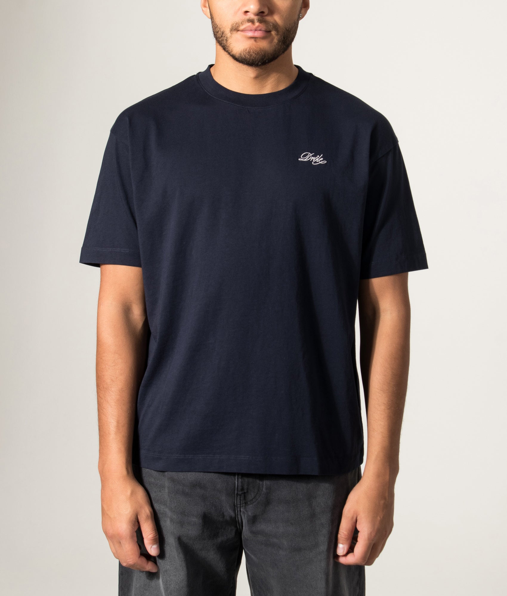 Drôle de Monsieur Relaxed Fit Drôle Belissima T-shirt in Navy at EQVVS Menswear. Model front shot.