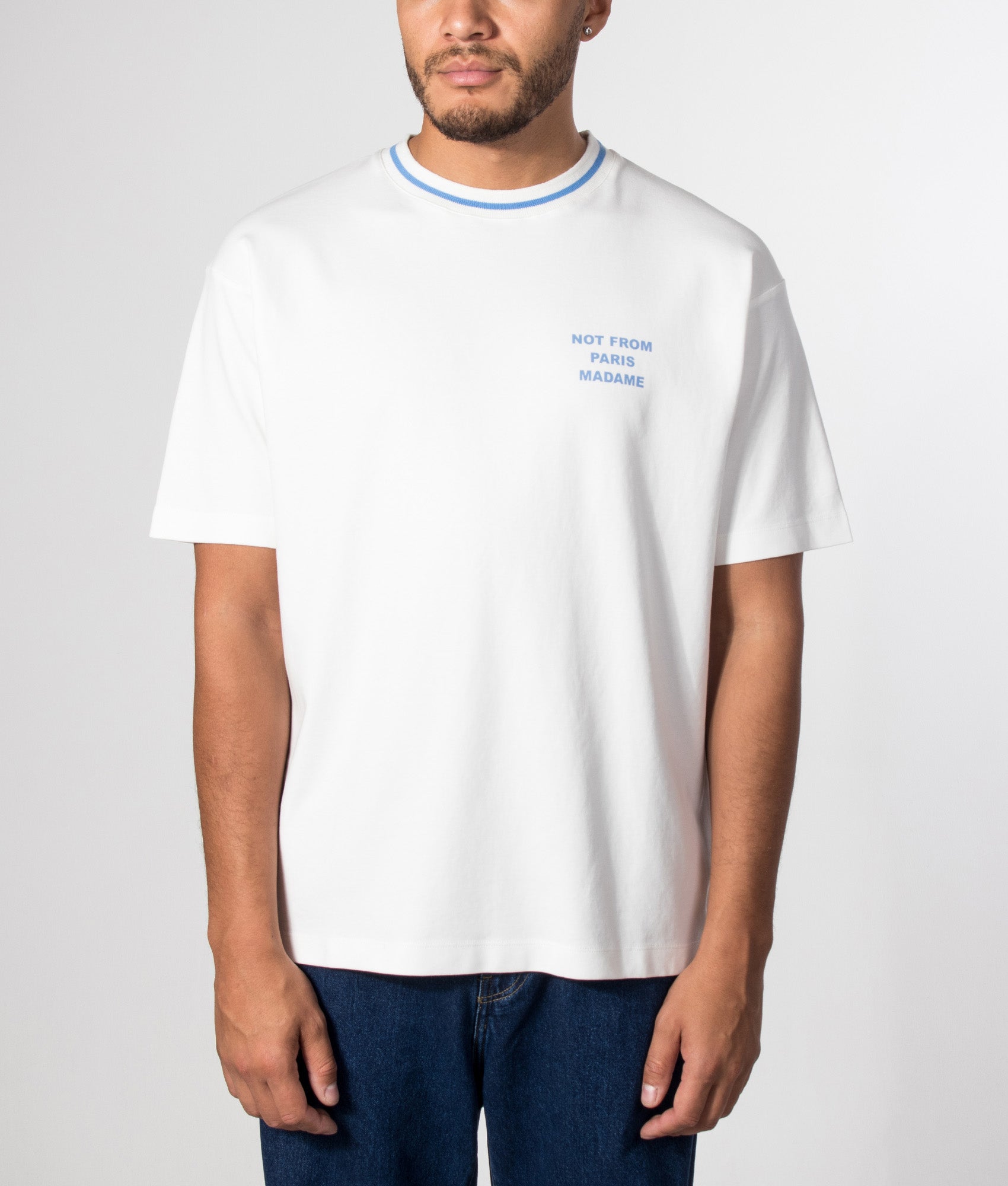 Drôle de Monsieur Sport Slogan T-shirt in Off White at EQVVS Menswear. Model front shot.
