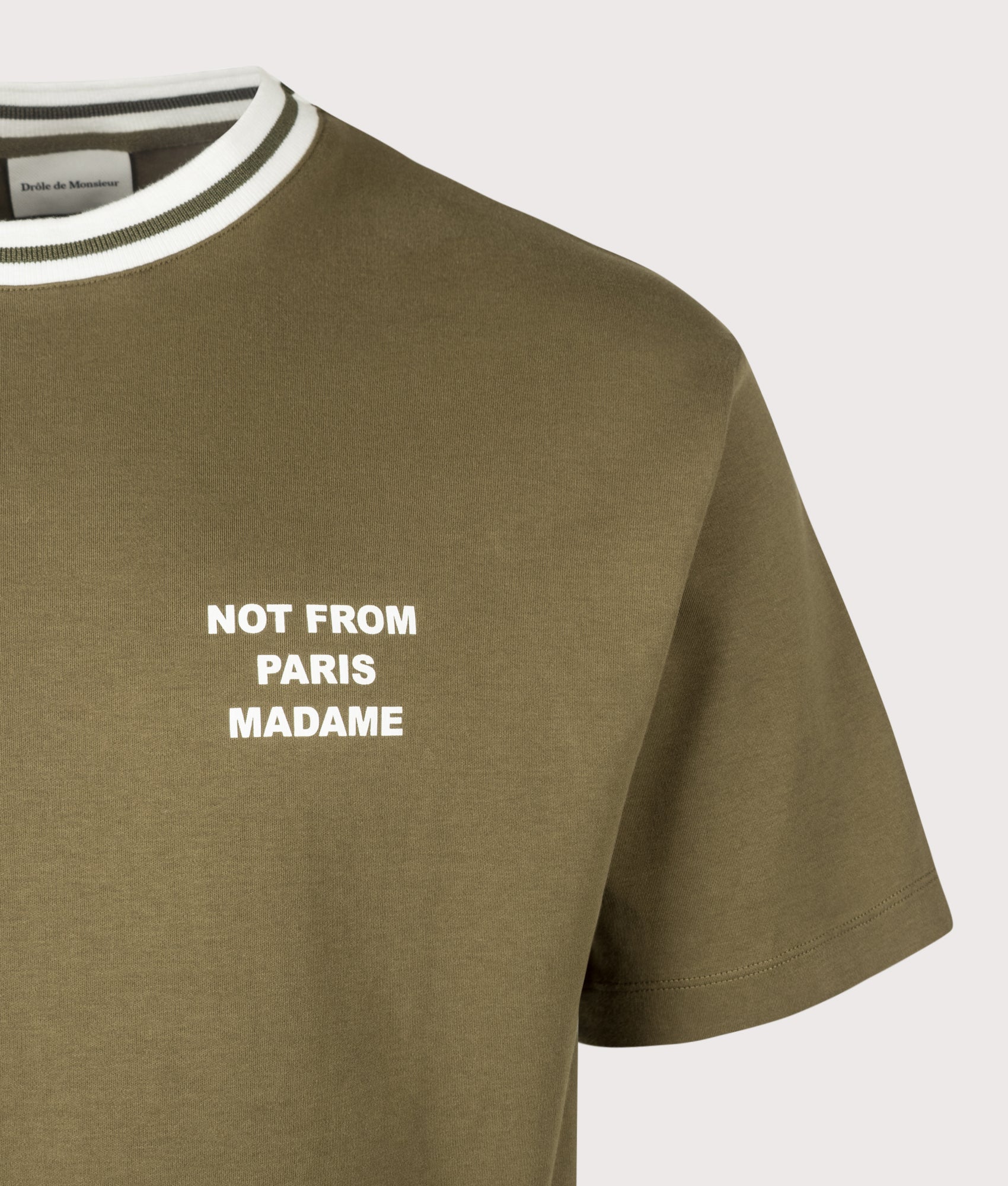 Drôle de Monsieur Sport Slogan T-shirt in Khaki at EQVVS Menswear. Detail shot.