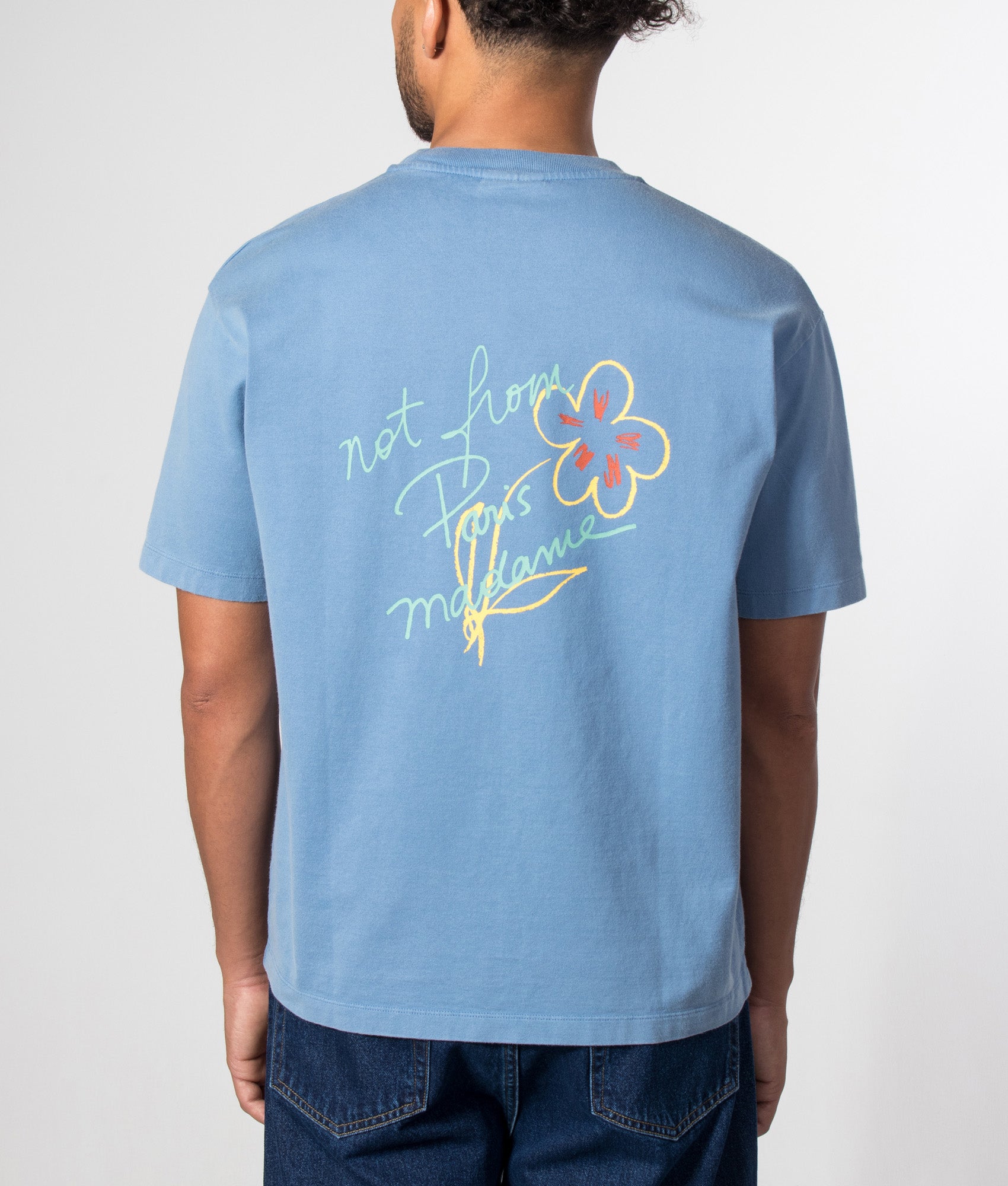 Drôle de Monsieur Relaxed fit Esquisse Slogan T-shirt in Light Blue at EQVVS Menswear. Model back shot.