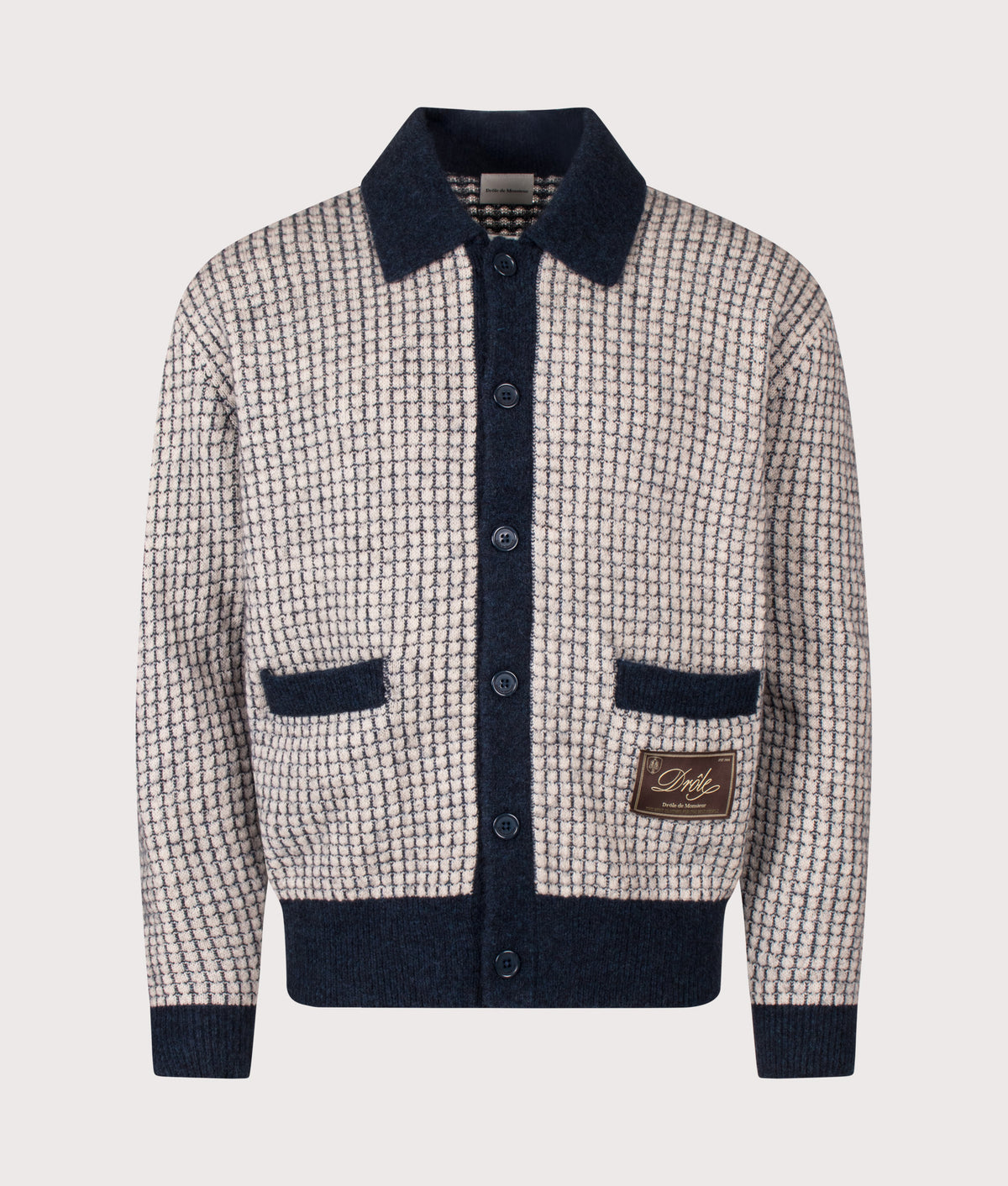 Drôle de Monsieur Relaxed Fit Drôle Patch Waffle Knit Cardigan in Navy at EQVVS Menswear. Front shot.