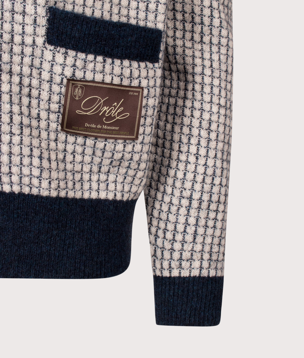 Drôle de Monsieur Relaxed Fit Drôle Patch Waffle Knit Cardigan in Navy at EQVVS Menswear. Detail shot.
