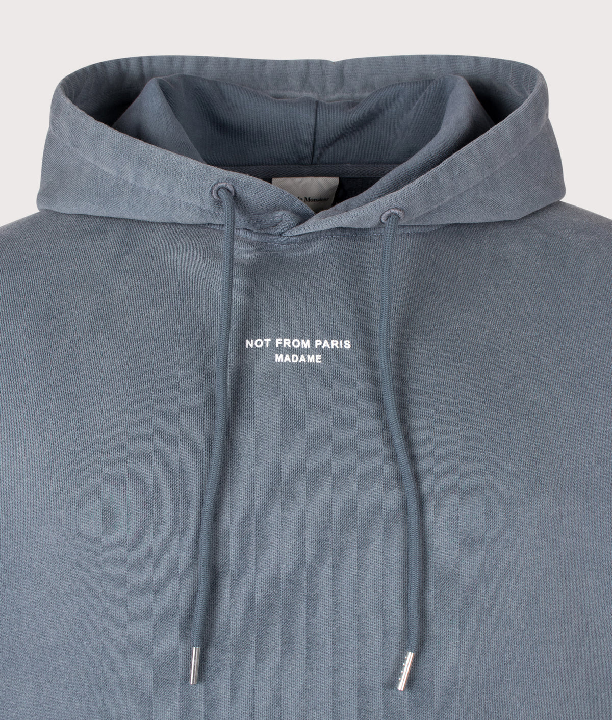 Drôle de Monsieur Relaxed Fit Classic Slogan Hoodie in Dark Grey at EQVVS Menswear. Detail shot.