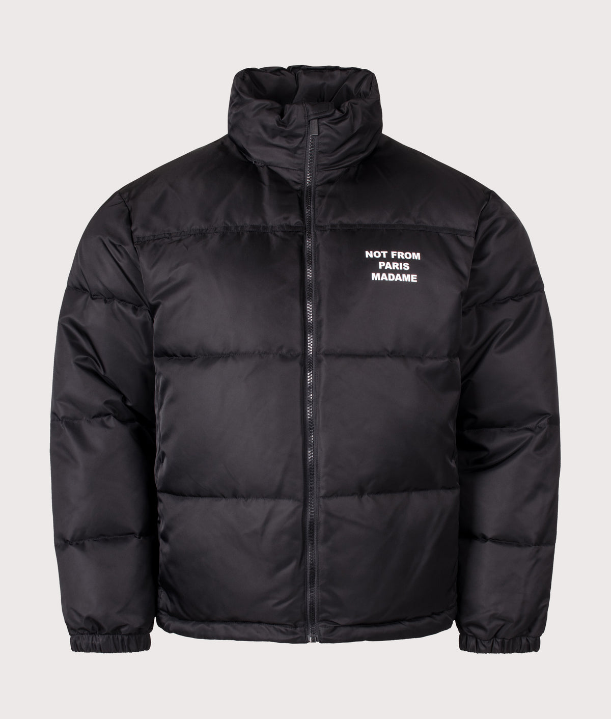 Drôle de Monsieur Relaxed Fit Slogan Puffer Jacket in Black at EQVVS Menswear. Front shot.