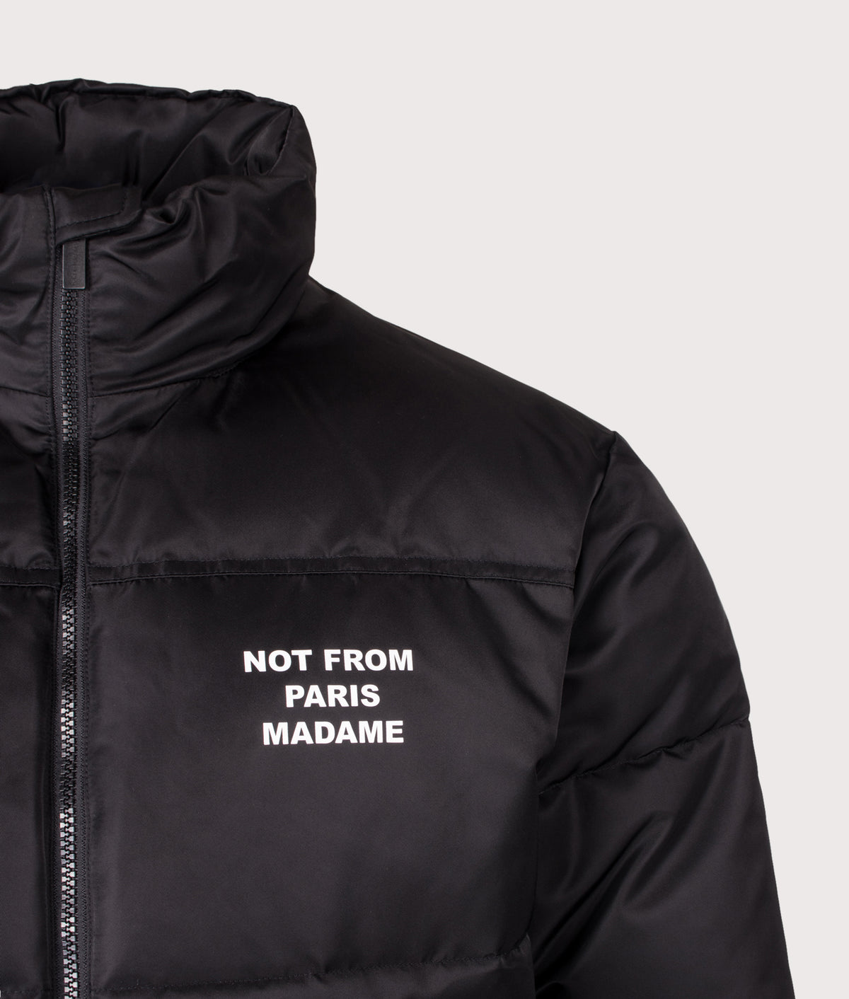 Drôle de Monsieur Relaxed Fit Slogan Puffer Jacket in Black at EQVVS Menswear. Detail shot.