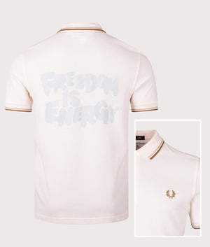 COMME des GARÇONS x Fred Perry Freedom is Energy Polo Shirt. Shot by EQVVS. Front/detail shot.
