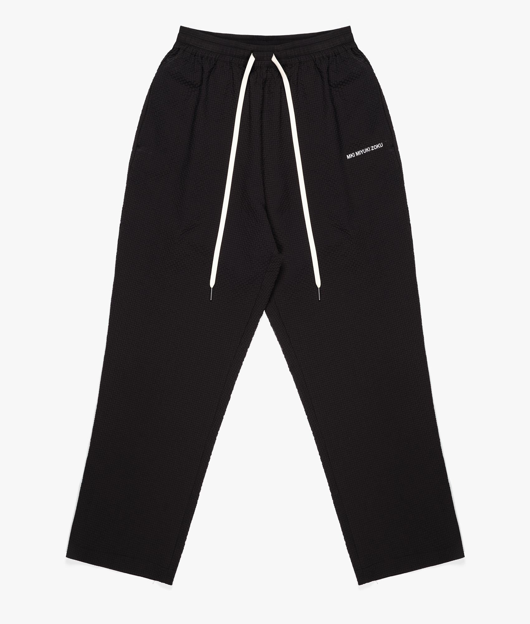 Relaxed Fit Seersucker Trousers in Black by MKI MIYUKI ZUKO, EQVVS Flat Front Shot.