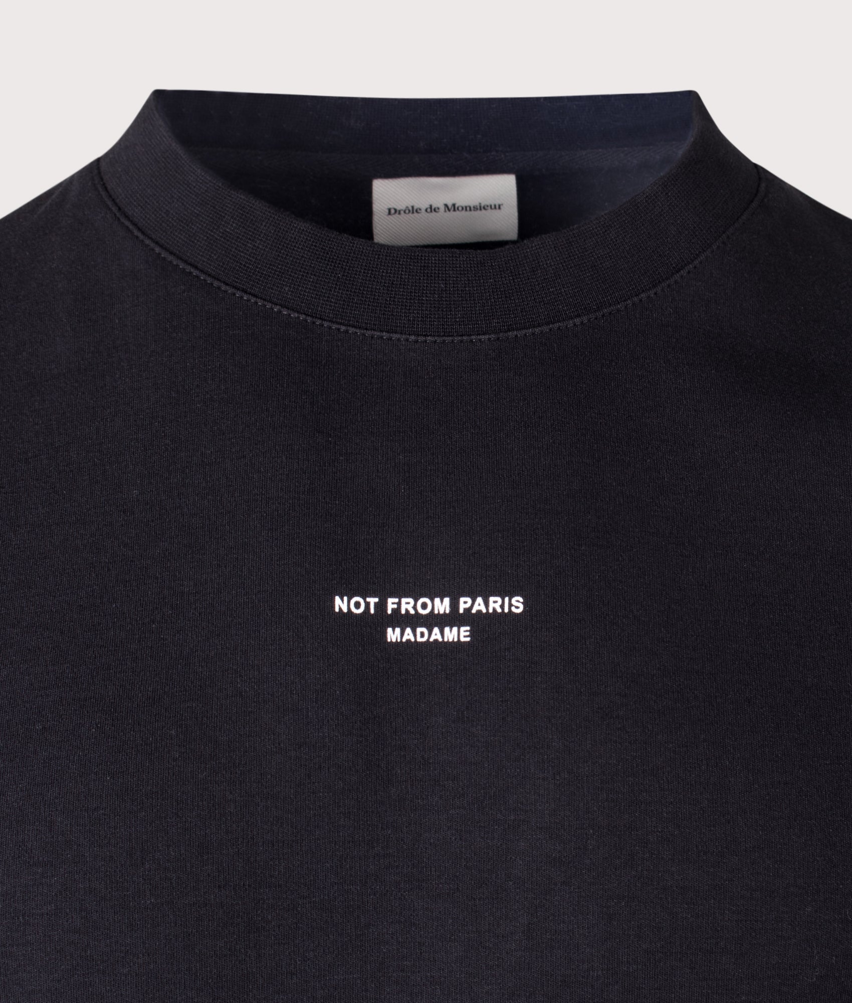 Drôle de Monsieur Relaxed Fit Classic Slogan T-shirt in Black at EQVVS Menswear. Detail shot.