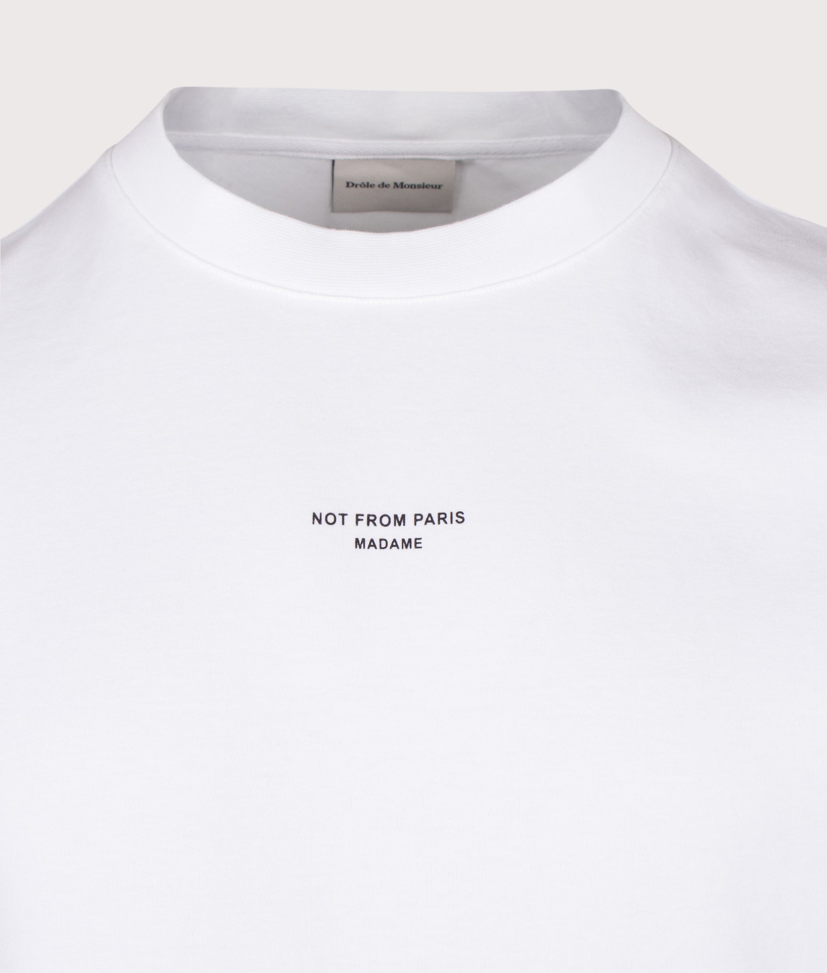Drôle de Monsieur Relaxed Fit Classic Slogan T-shirt in Optic White at EQVVS Menswear. Detail shot.