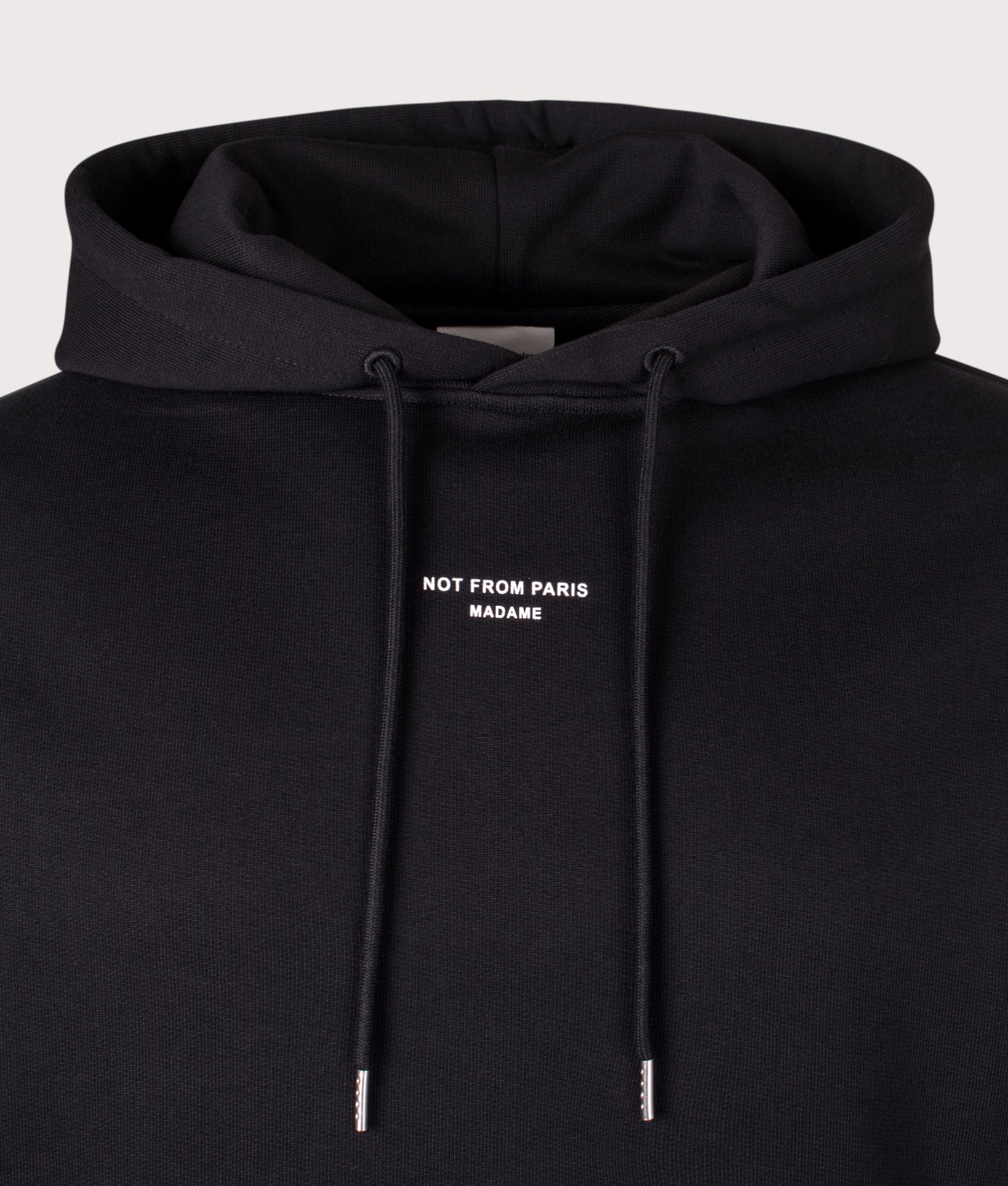 Le Hoodie Slogan Poche Classique. Shot by EQVVS. Front slogan shot.